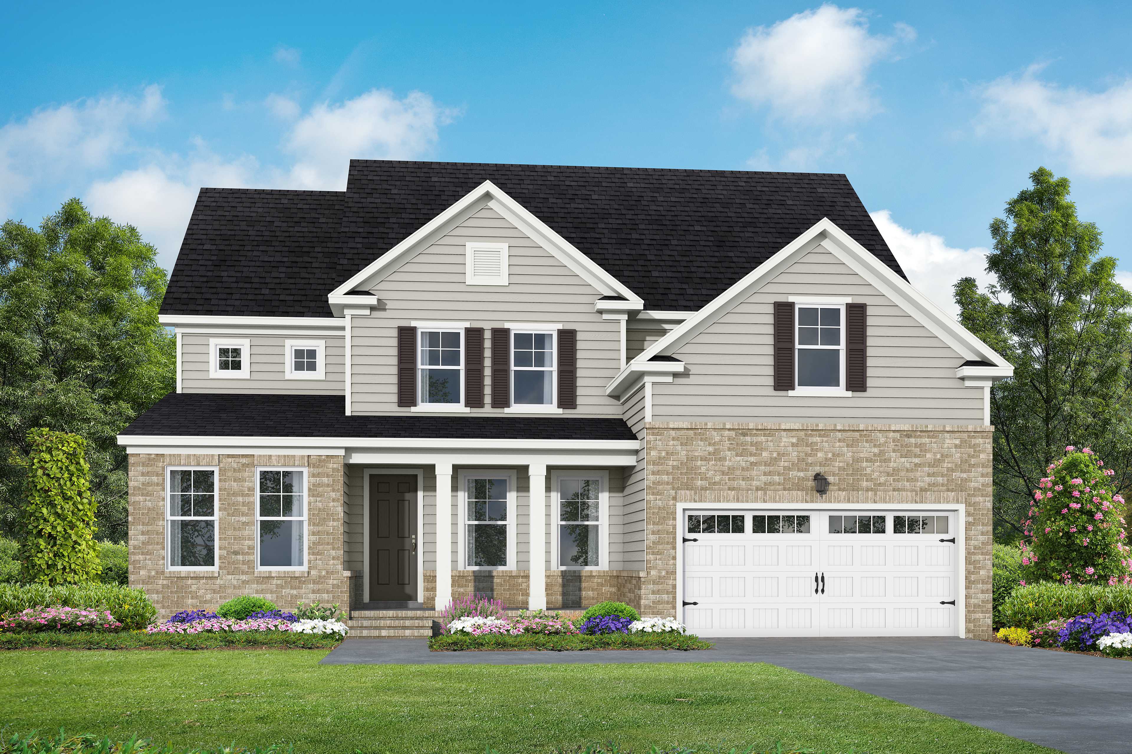 Two-story Crawford home elevation by Davidson Homes in Raleigh, NC, featuring brick accents, siding, covered porch, 2-car garage, and lush landscaping