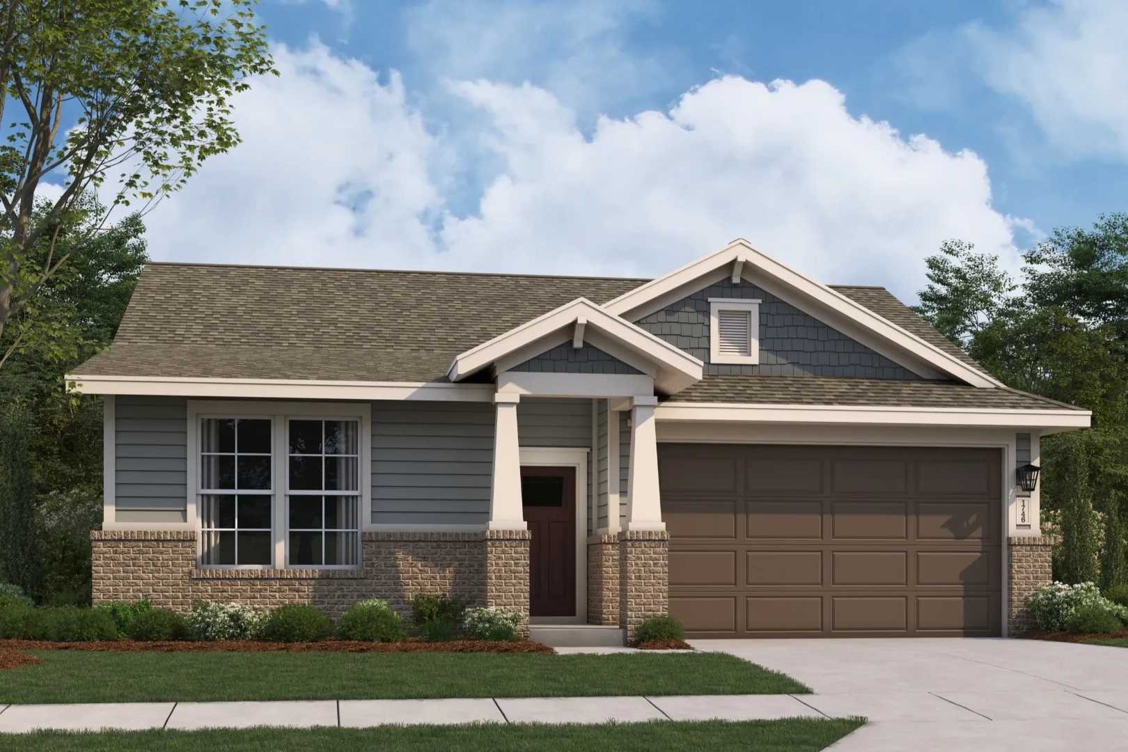 Craftsman style home exterior at Anderson Lakes in Opelika Alabama with covered porch brick accents and garage