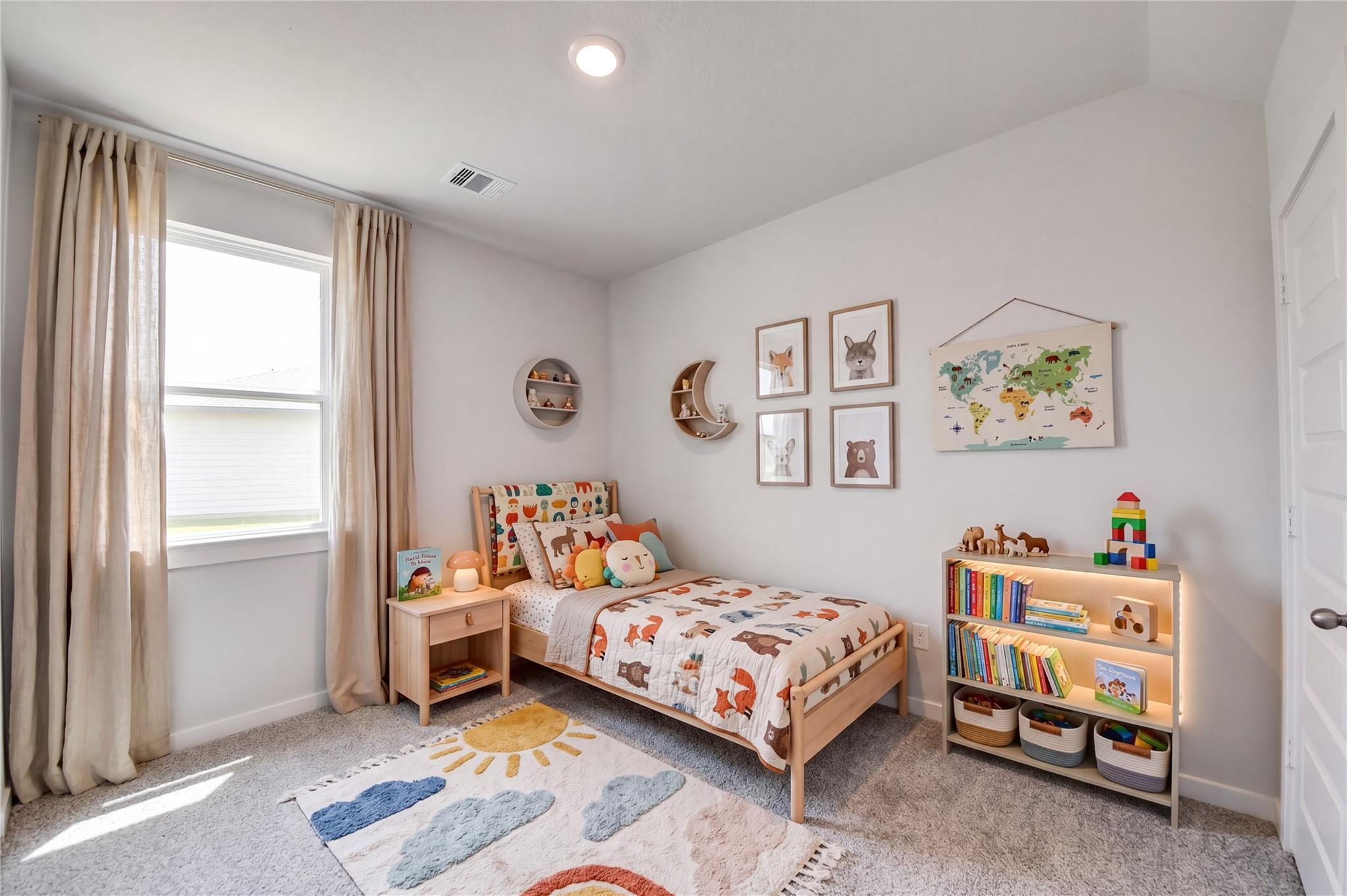Bright kids bedroom with twin bed, bookshelf, and playful decor in Davidson Homes The Sabine F, Liberty Estates, Cleveland, Texas