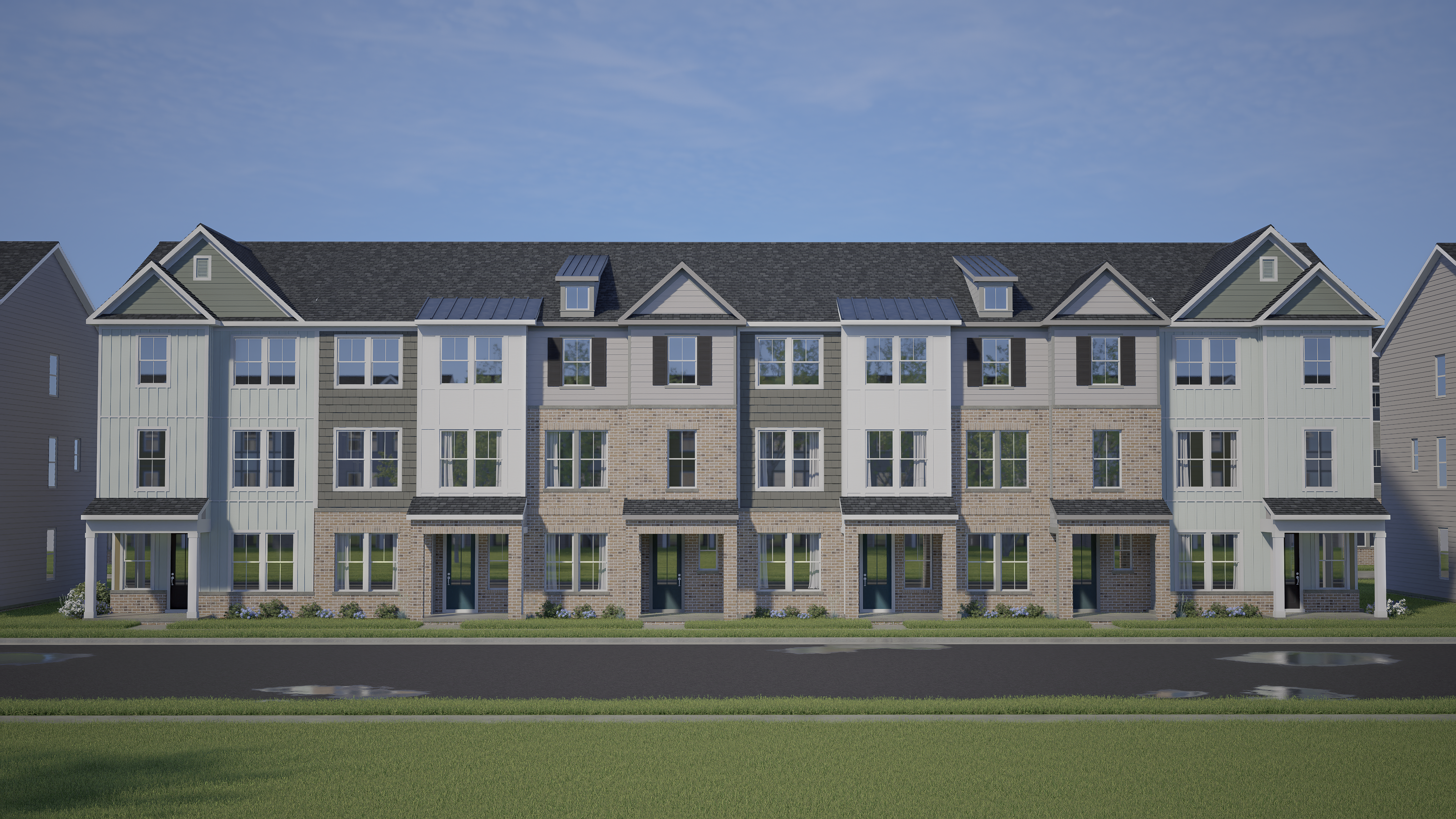 Row of modern townhomes at Forestville Yard in Knightdale NC with gabled roofs, varied siding, and front porches