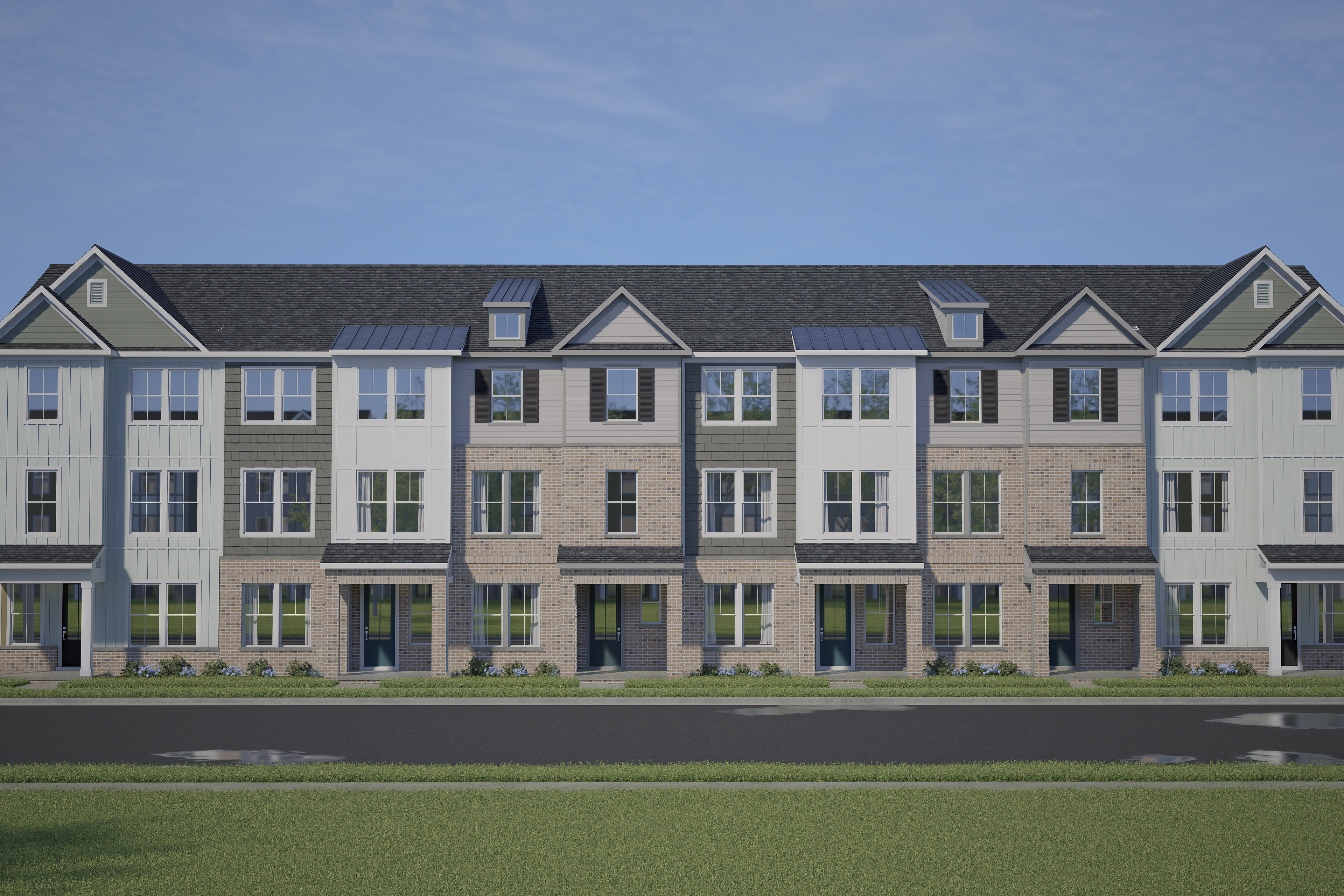 Row of modern townhomes at Forestville Yard in Knightdale NC with gabled roofs, varied siding, and front porches