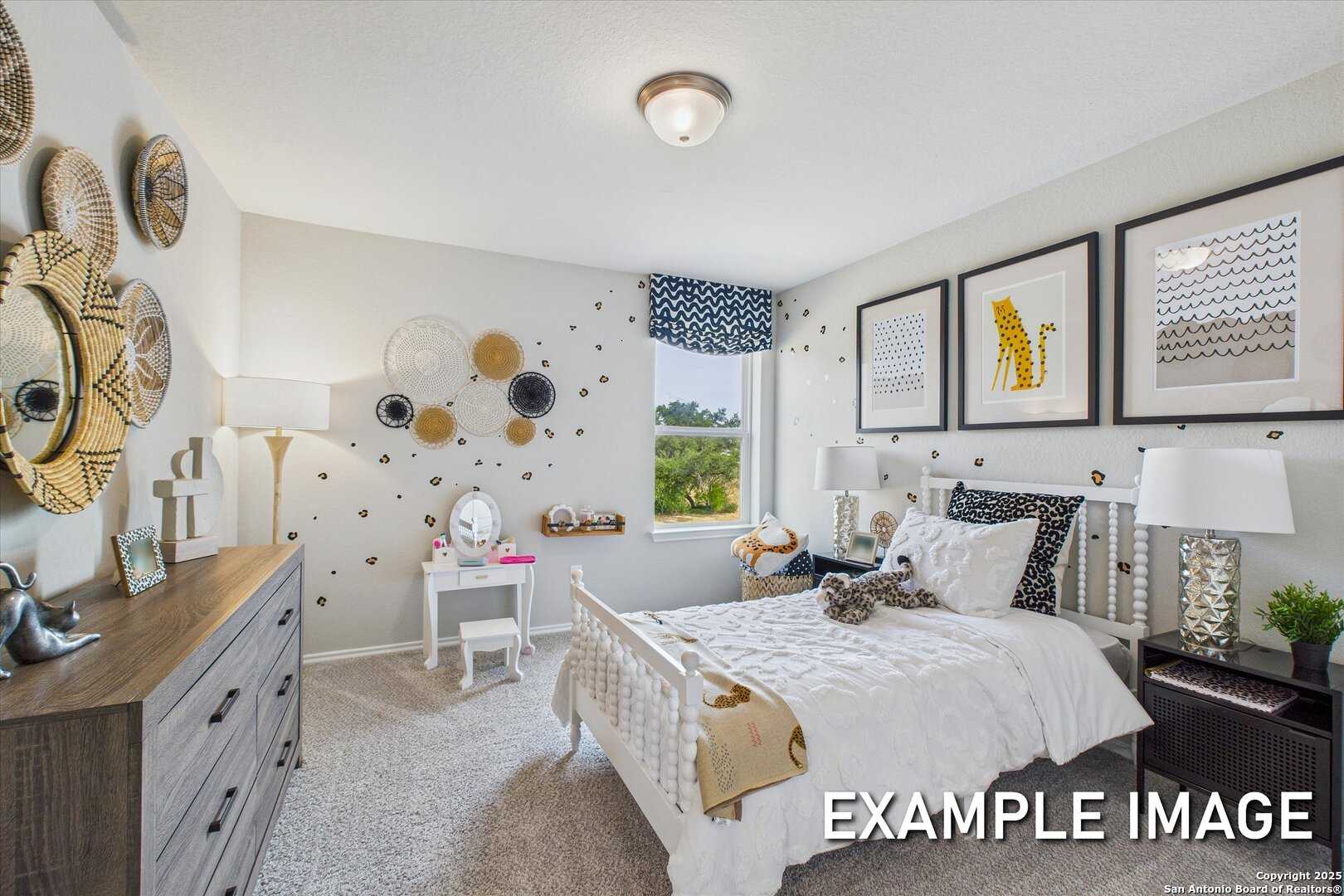 Whimsical girl's bedroom with white bed, wooden dresser, vanity desk, woven wall art, leopard prints in Davidson Homes The Sabine C, San Antonio