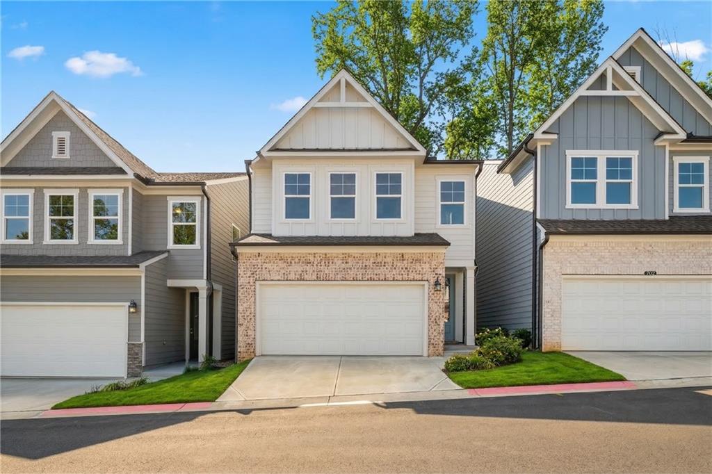 Modern 2-story Davidson Homes with brick accents, 2-car garages, and siding exteriors in The Village at Shallowford, Kennesaw, Georgia