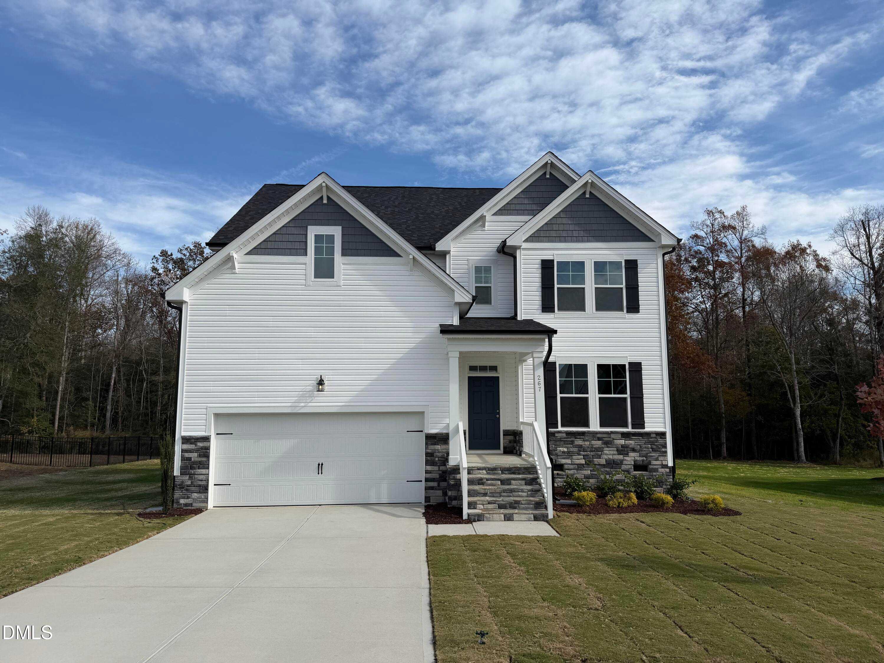 Modern 3-story white home with dark roof, 2-car garage, and covered porch in Wellers Knoll, Lillington, NC - Davidson Homes Hickory II A