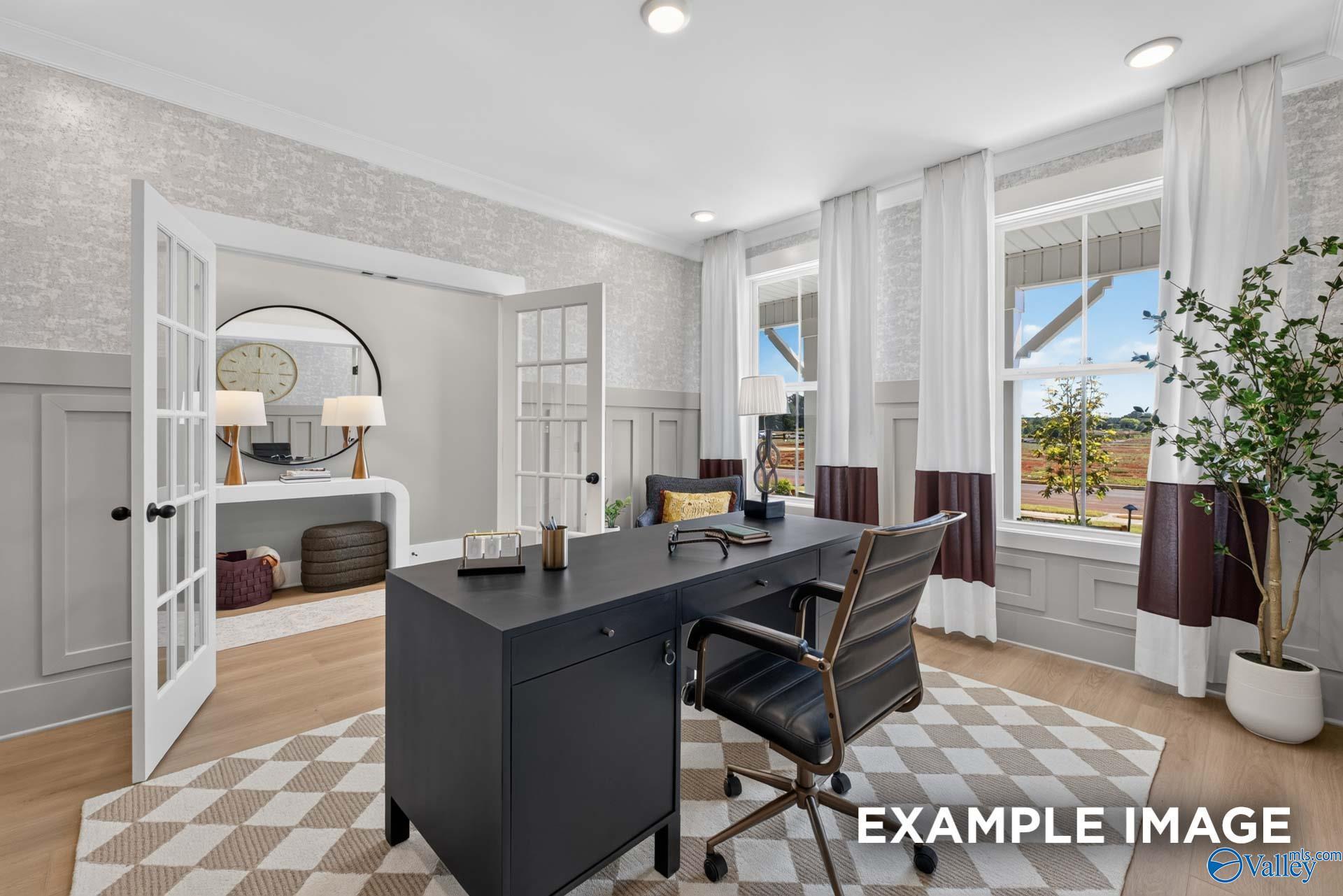 Elegant home office with French doors, black desk, and wainscoting in Davidson Homes Ashport K plan, Forest Glen, Hazel Green, Alabama