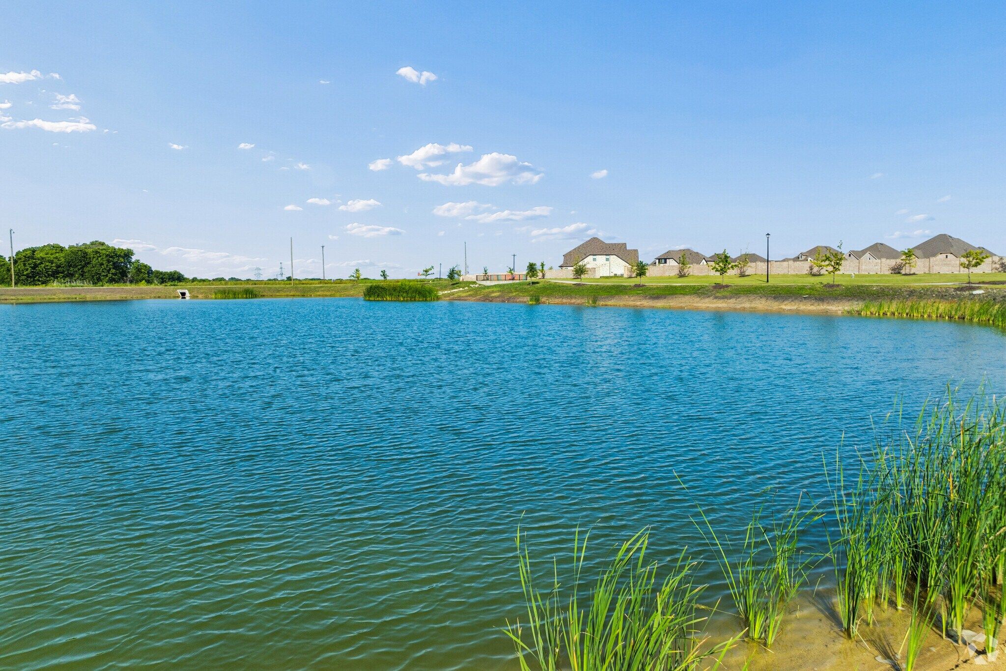 Community fishing pond amenity at Mercer Meadows in Royse City, TX