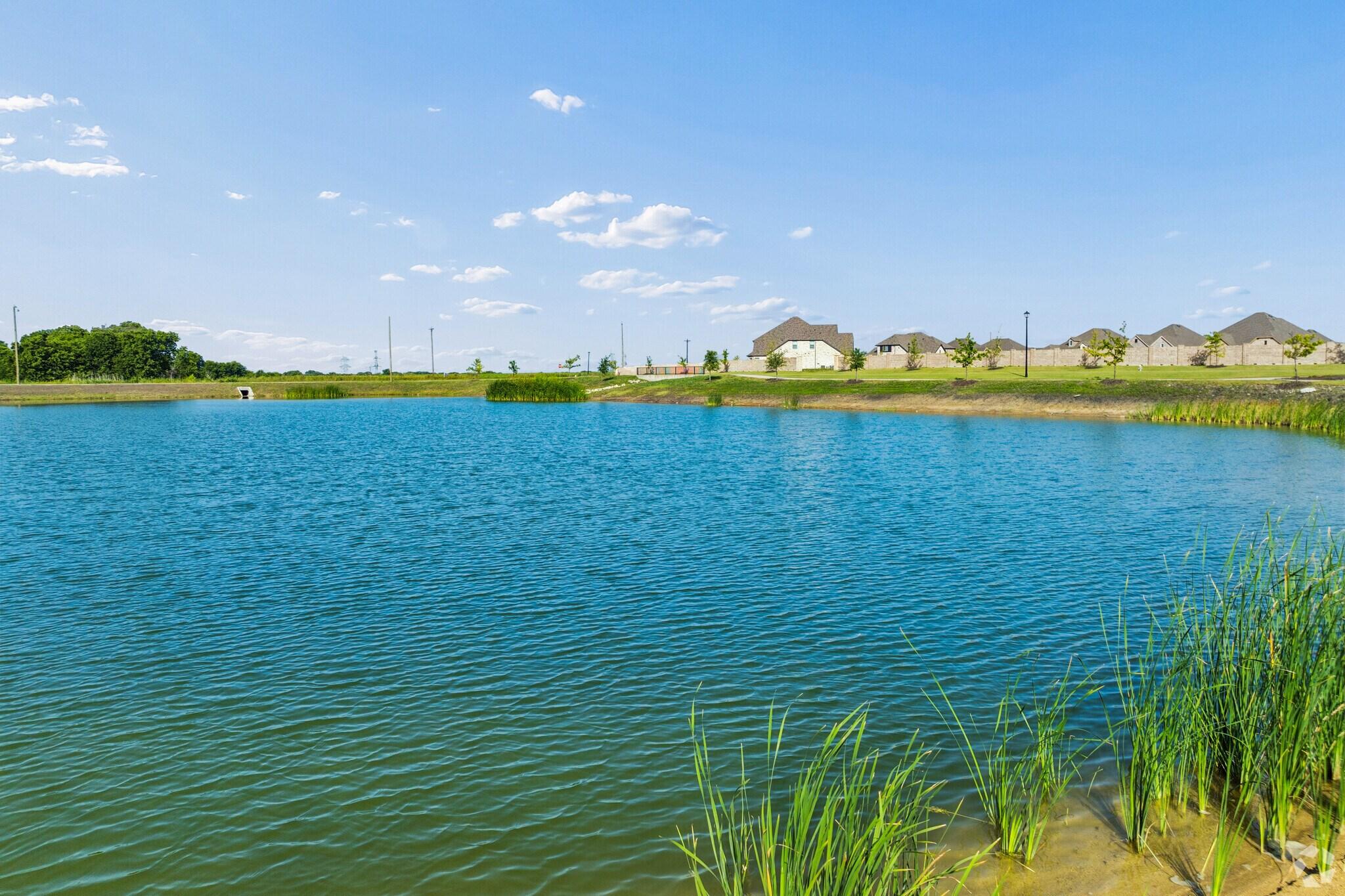 Community fishing pond amenity at Mercer Meadows in Royse City, TX