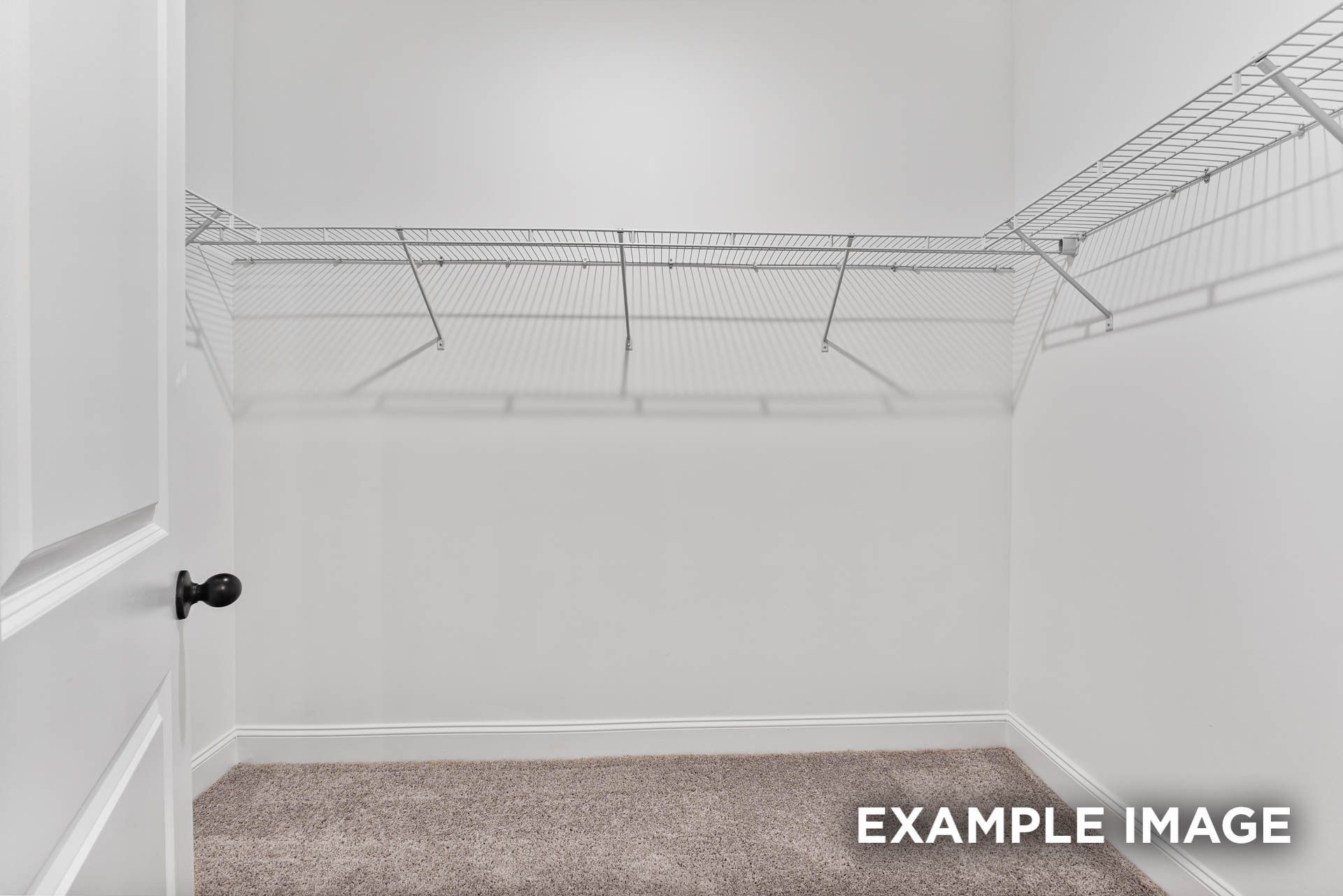 Spacious walk-in closet with wire shelving in The Franklin E floor plan at Bailey Park in Fayetteville, Tennessee.