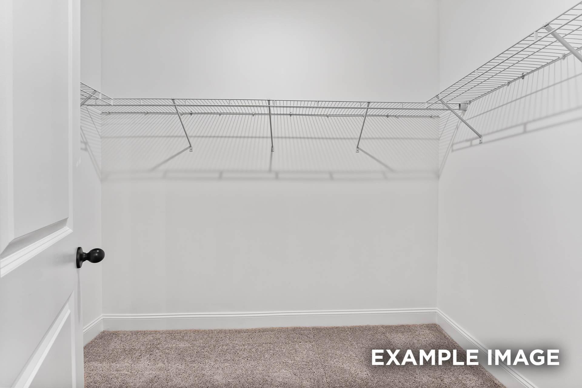 Spacious walk-in closet with wire shelving in The Franklin E floor plan at Bailey Park in Fayetteville, Tennessee.