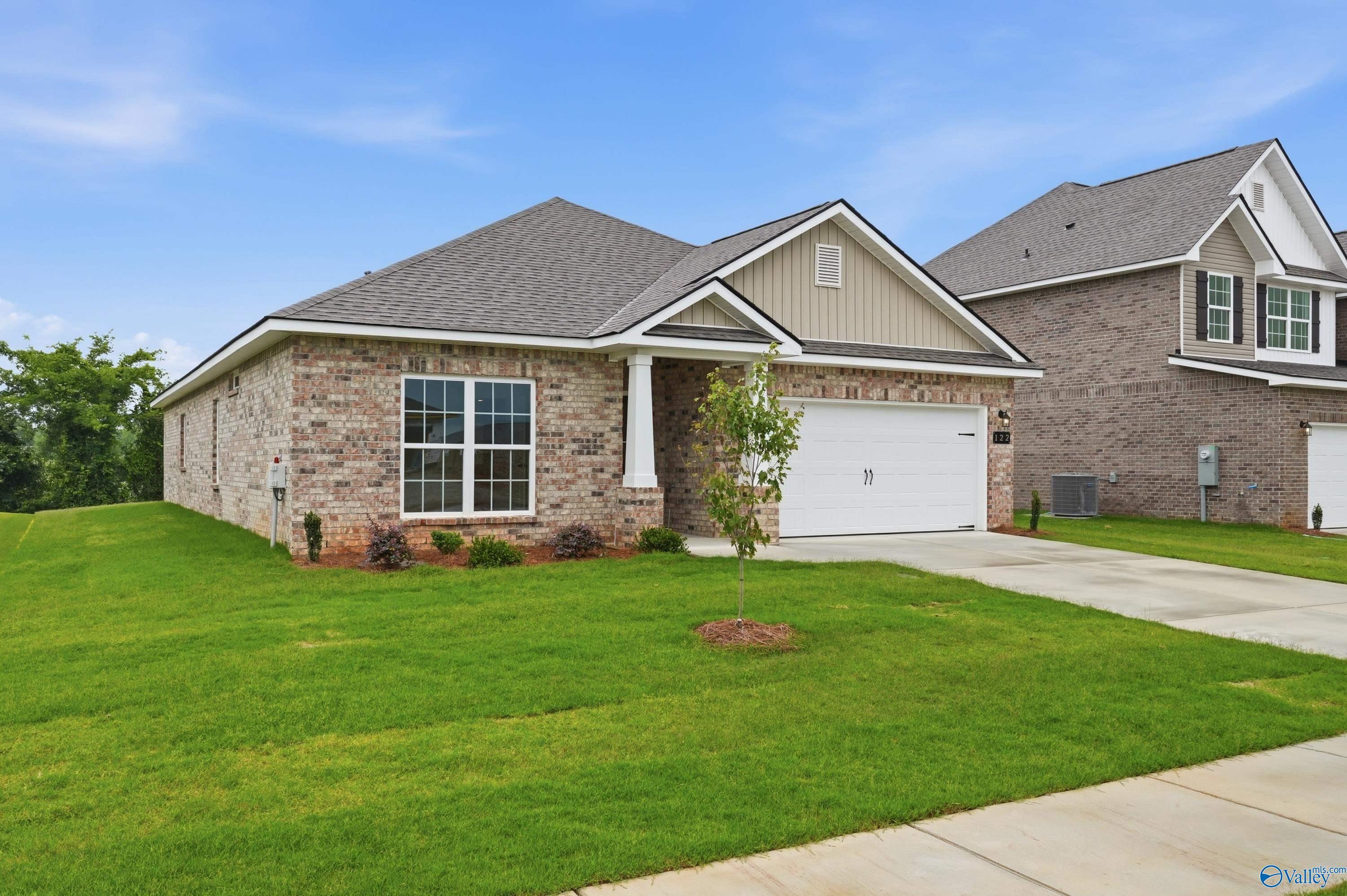 Single-story 4-bedroom home in Ivy Hills, Toney, AL featuring The Daphne C floor plan by Davidson Homes with 2-car garage.