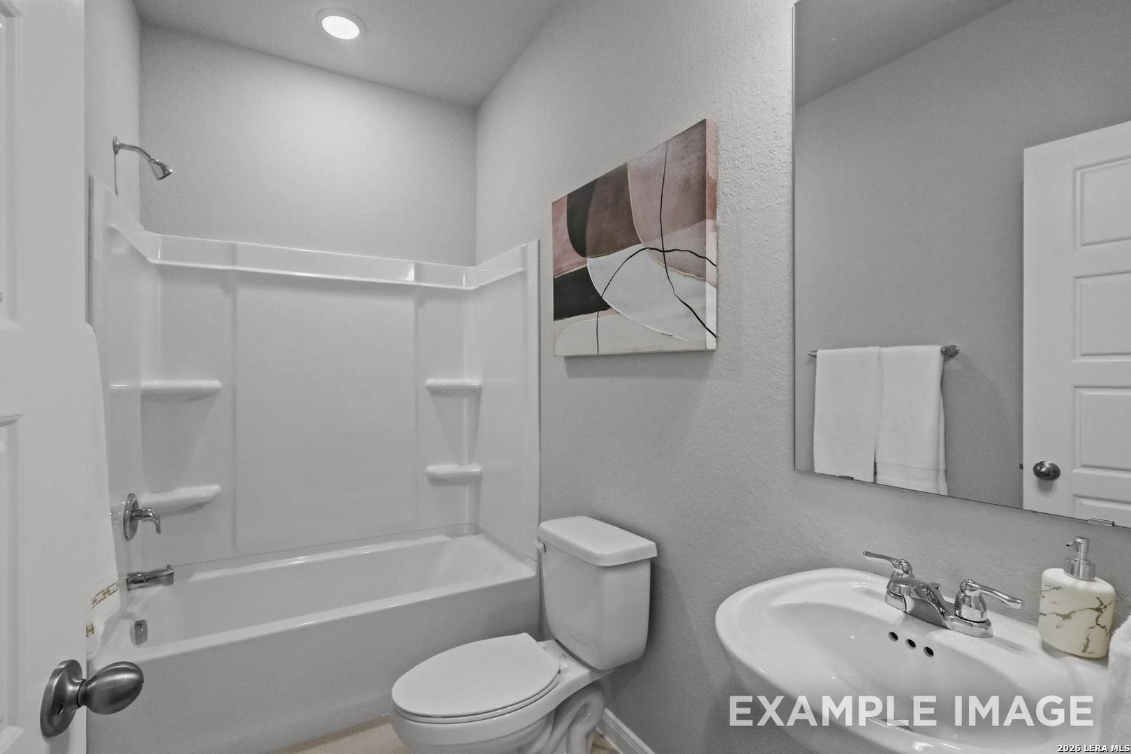 Modern full bathroom with tub-shower combo in The Gillian A floor plan by Davidson Homes in Cedar Heights, San Antonio.