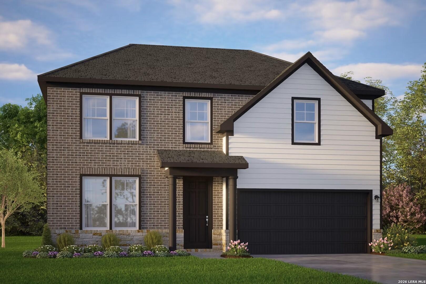 Two-story brick and siding home exterior, The Murray G floor plan by Davidson Homes in Hannah Heights, Seguin, Texas.