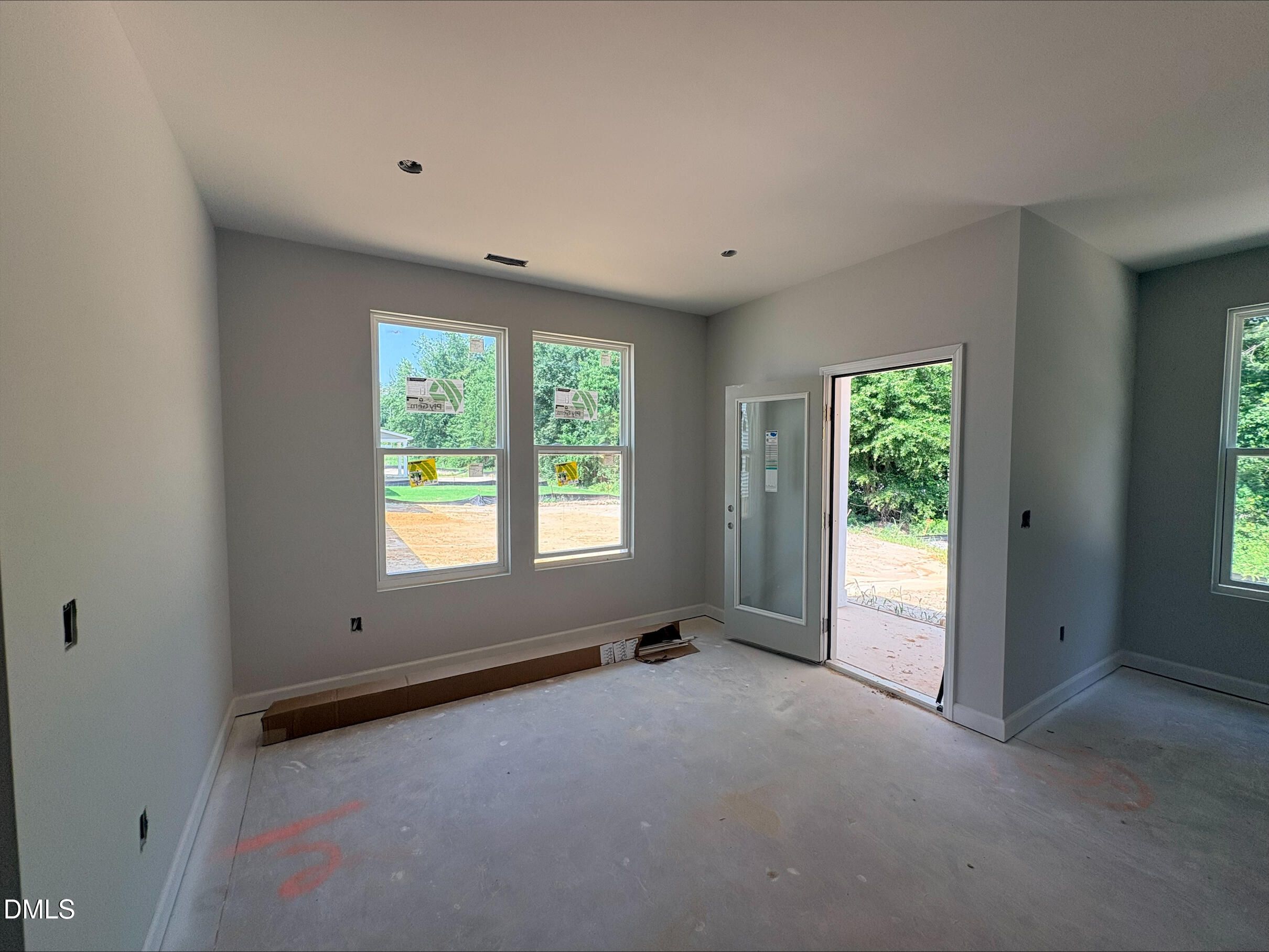 Unfinished dining area with patio access in The Daphne D floor plan at Woodland Crossing, Zebulon, North Carolina.