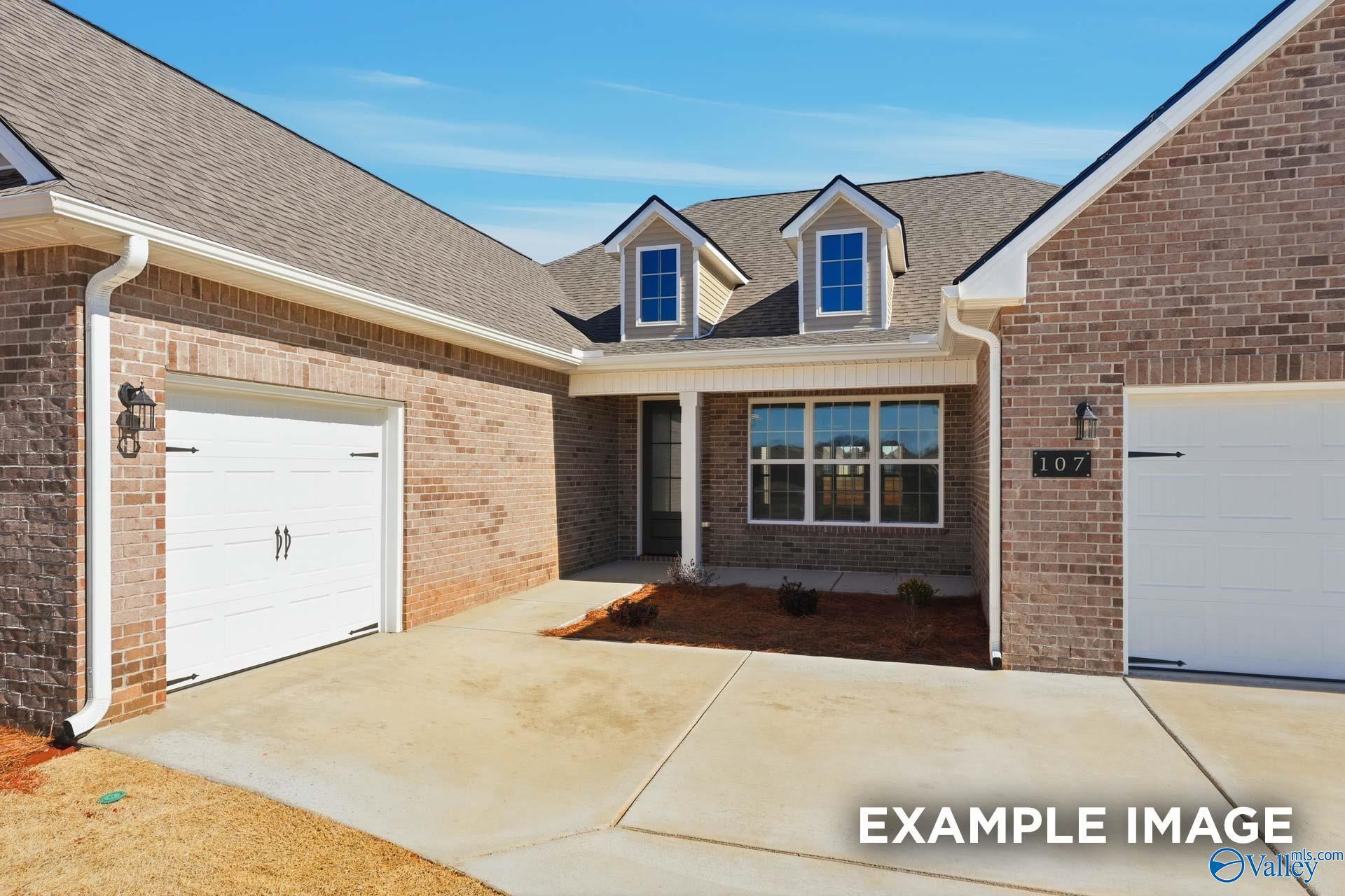 Brick exterior of The Valencia floor plan by Davidson Homes with a 3-car garage in Briercreek, Meridianville, Alabama.