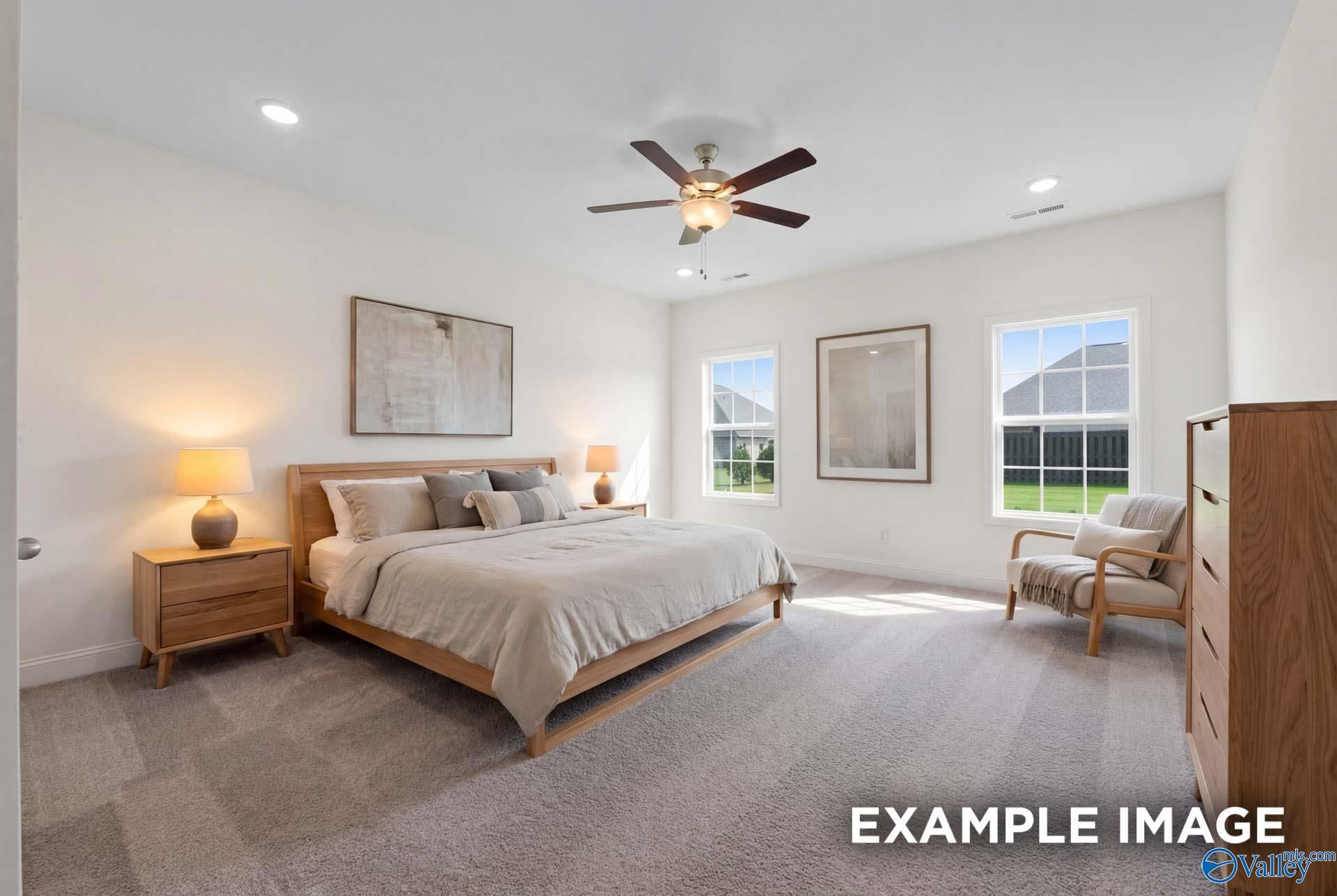 Spacious primary bedroom with neutral decor in The Rockford B floor plan by Davidson Homes in Kendall Downs, Toney, Alabama.