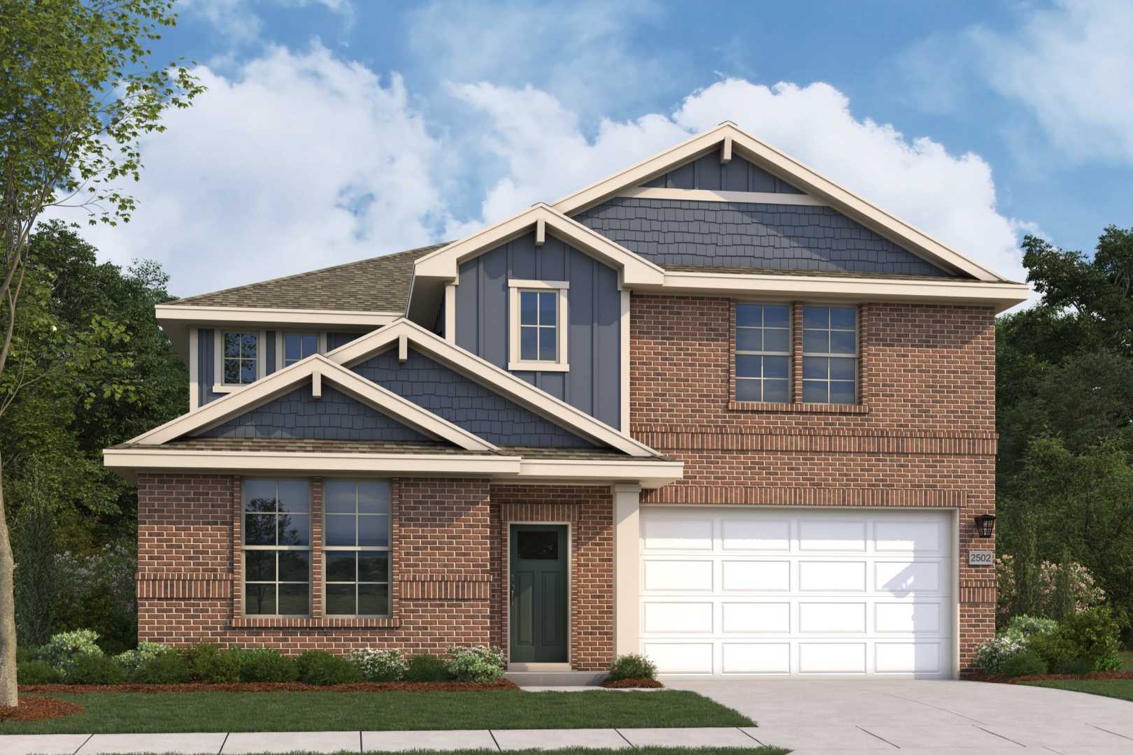 Two-story brick and shake elevation of The Radiance by Evermore Homes, featuring 2-car garage and landscaped yard in Perry, Georgia