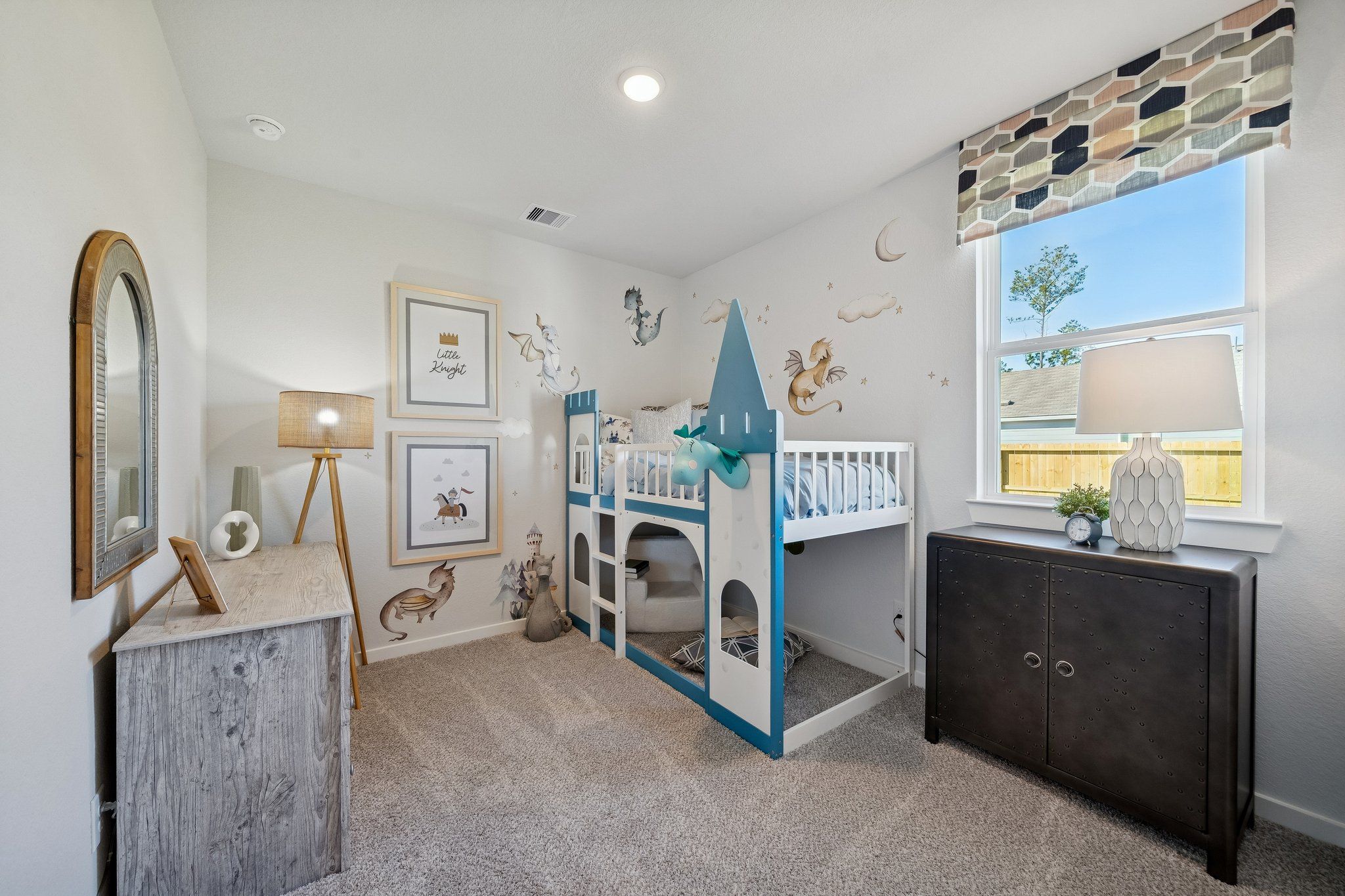 Castle-themed bunk bed in whimsical kids' bedroom at Spring Branch Crossing, Conroe TX with fairy tale murals and modern storage