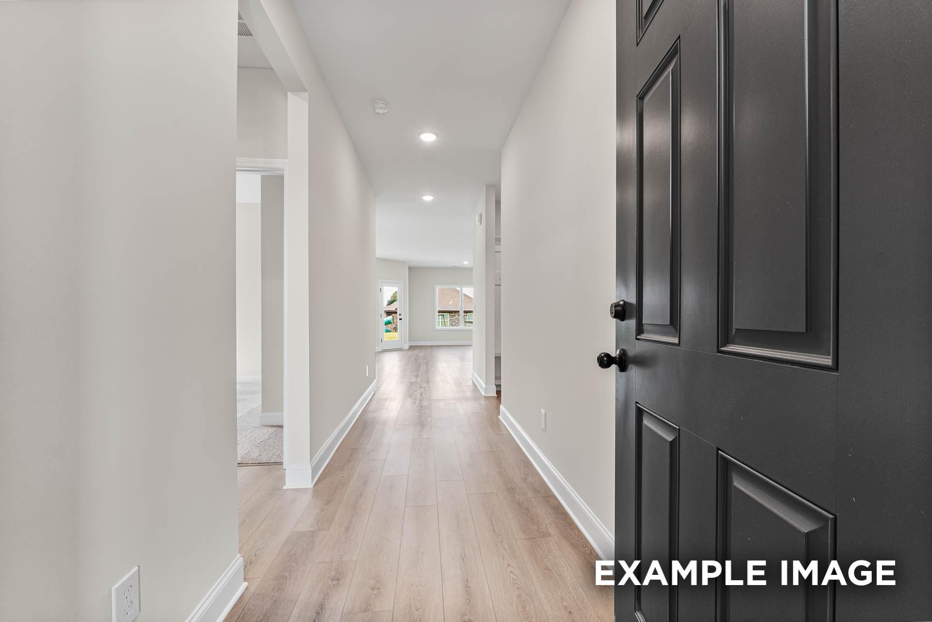 Bright entryway and hallway with wood-look flooring in The Franklin E floor plan at Bailey Park, Fayetteville, Tennessee.