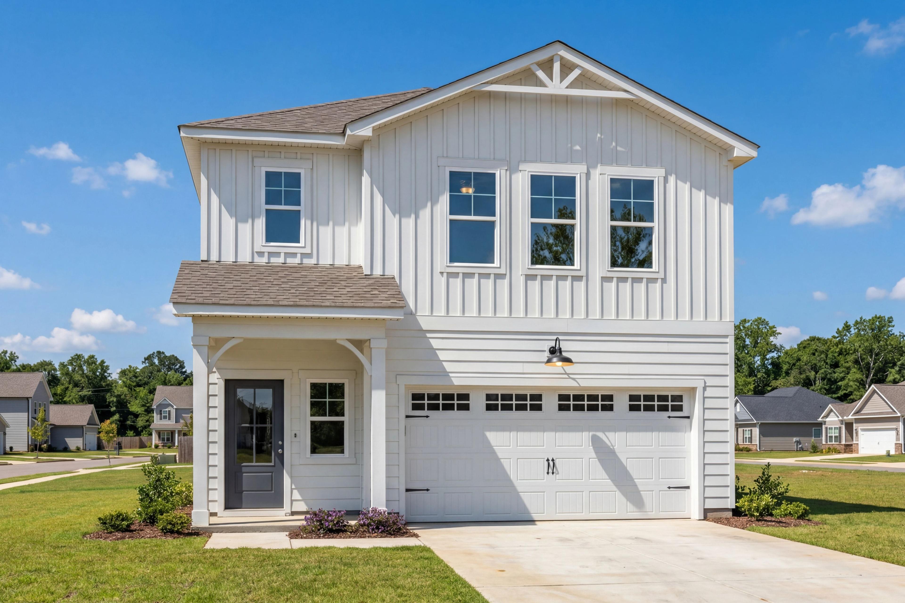 Craftsman-style exterior of The Hartwell B, a 2-story single-family home with white shingle siding and a 2-car garage.