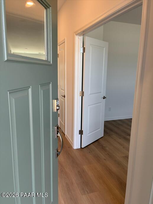 Entryway with light green door and wood-look flooring in The Coronado A floor plan at South Ranch, Prescott, Arizona.