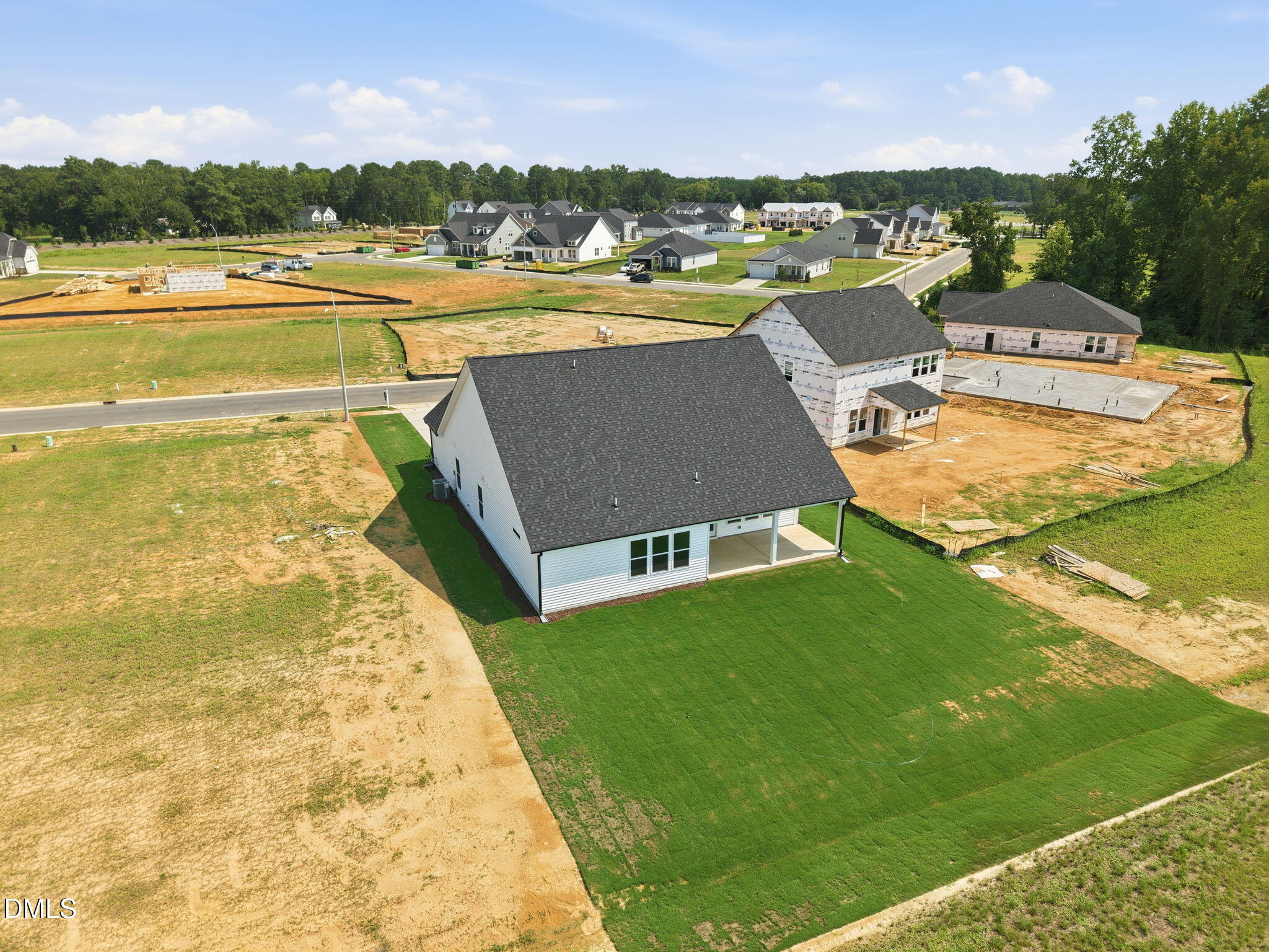 Aerial view of The Magnolia B floor plan at Retreat at North Main in Lillington, NC, featuring a spacious backyard.