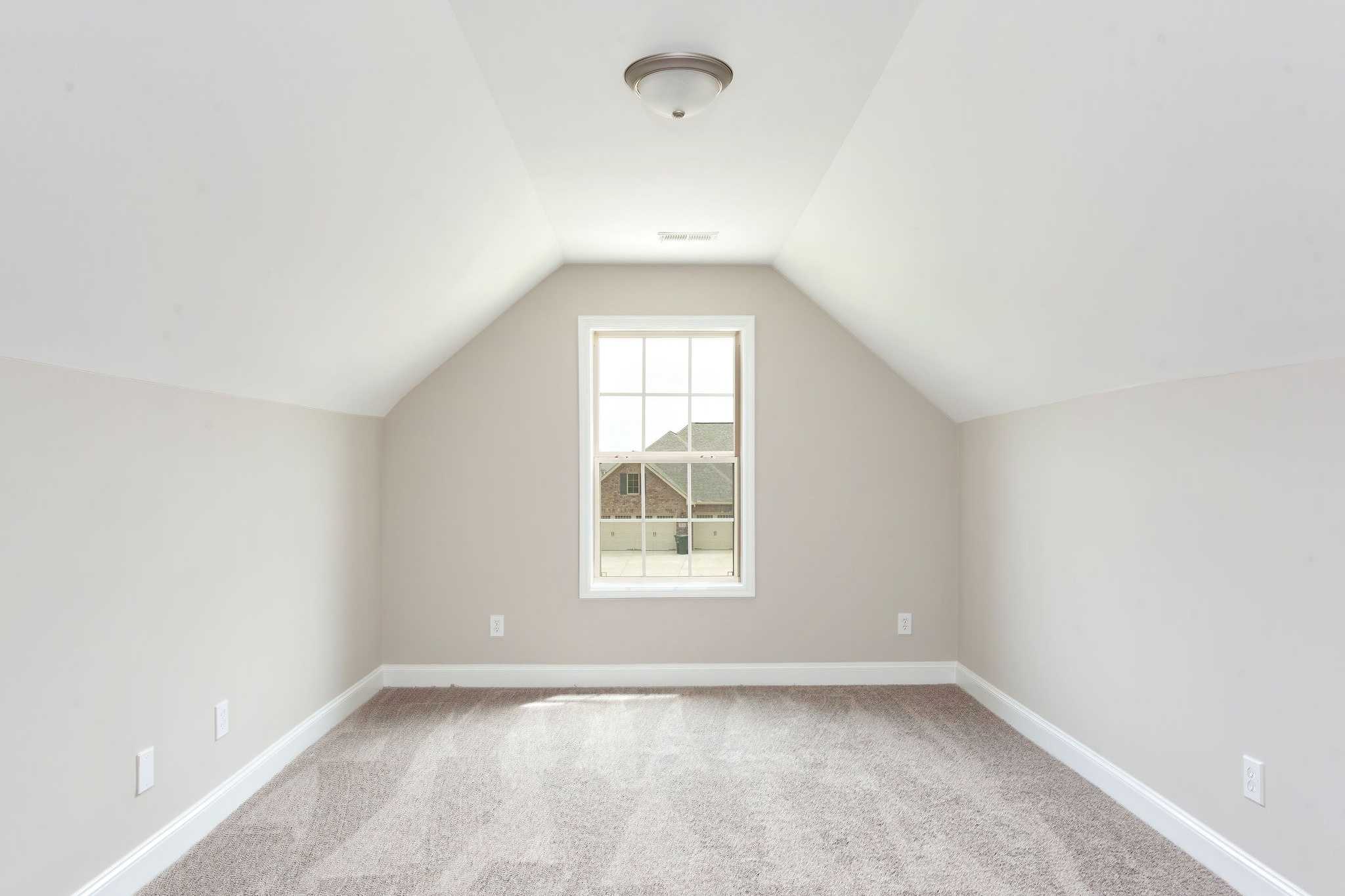 Davidson Homes The Emory Floor Plan unfurnished Bedroom with slanted ceilings and window