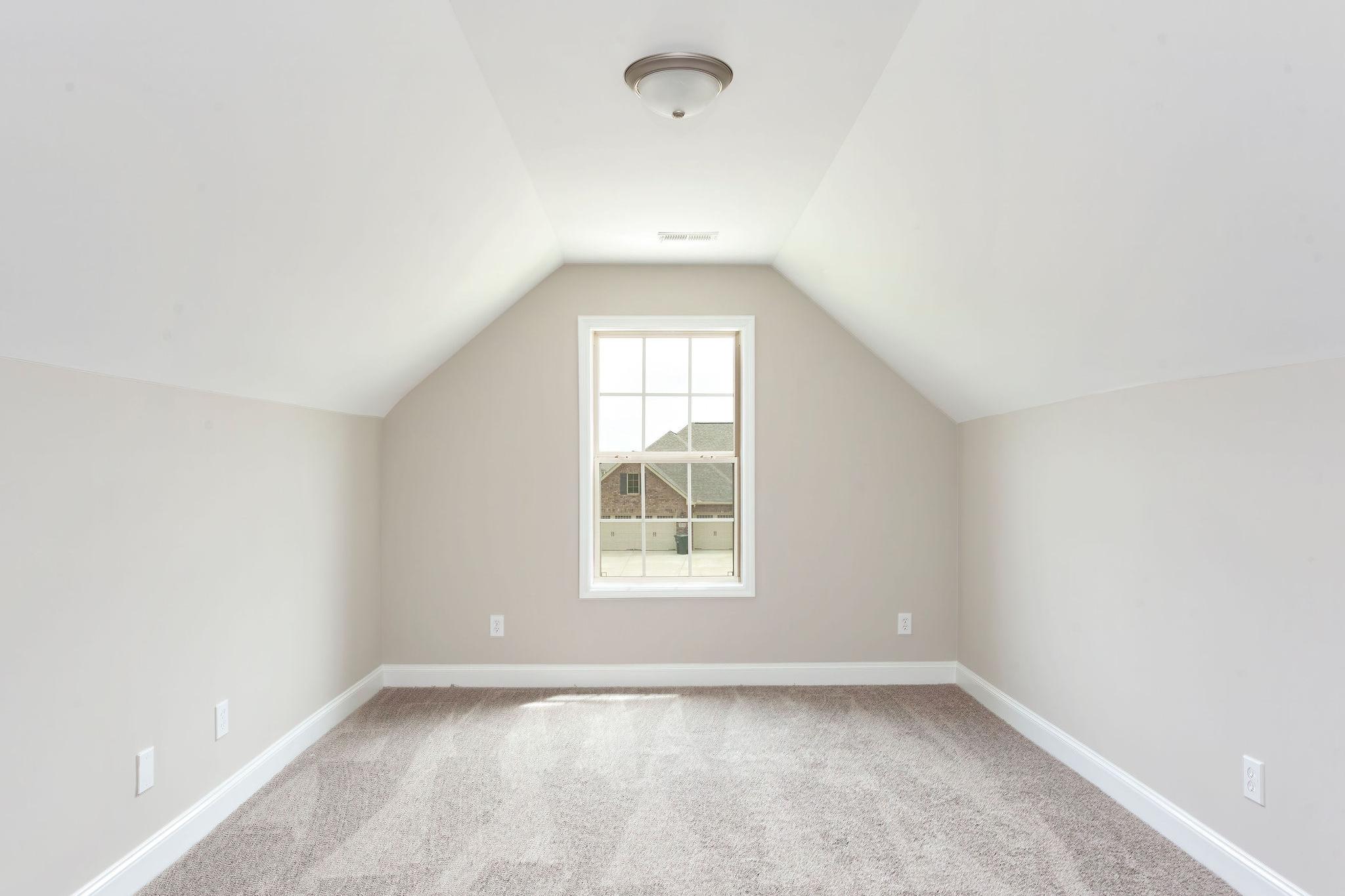 Davidson Homes The Emory Floor Plan unfurnished Bedroom with slanted ceilings and window