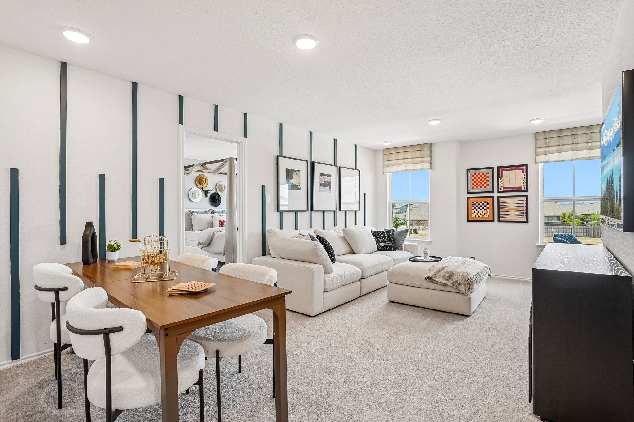 Open-concept living and dining area at Morgan Meadows in San Antonio, featuring modern decor and a spacious floor plan.