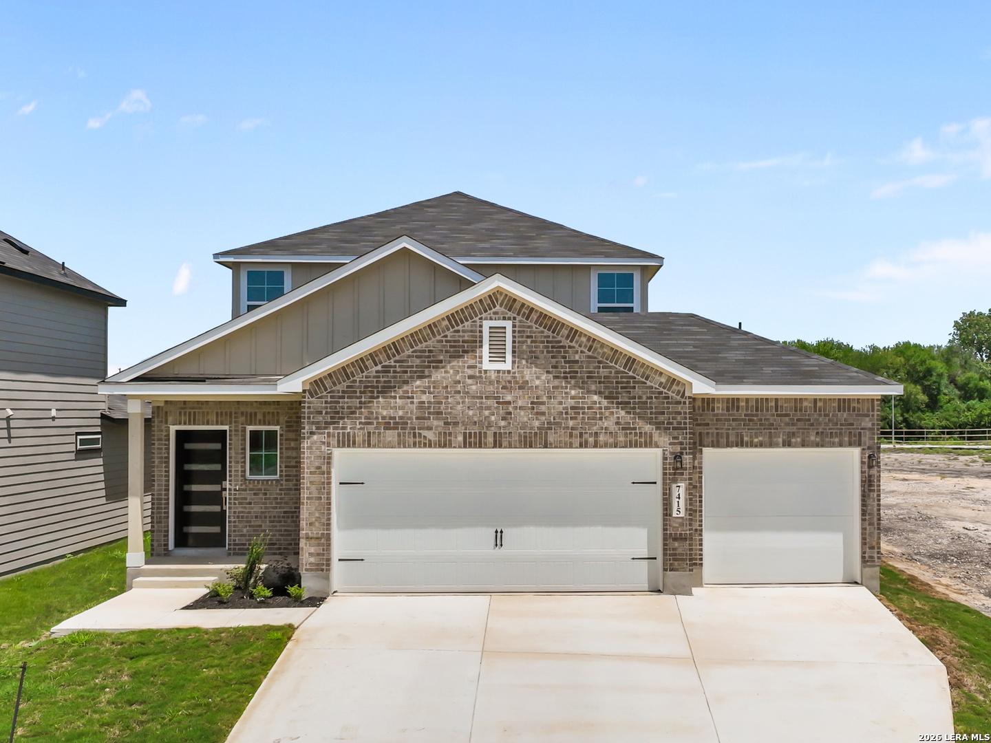 Two-story San Marcos F floor plan by Davidson Homes with brick exterior and 3-car garage in Rayburn Valley, San Antonio.