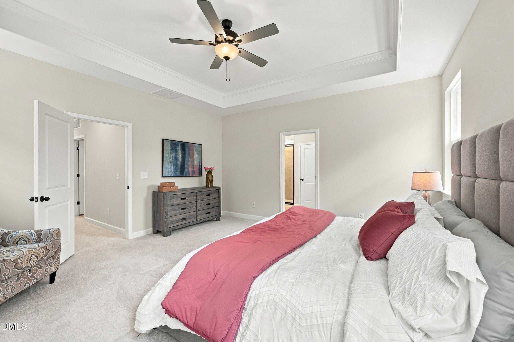 Spacious primary bedroom with tray ceiling in The Harris C floor plan at Forestville Yard, Knightdale, North Carolina.