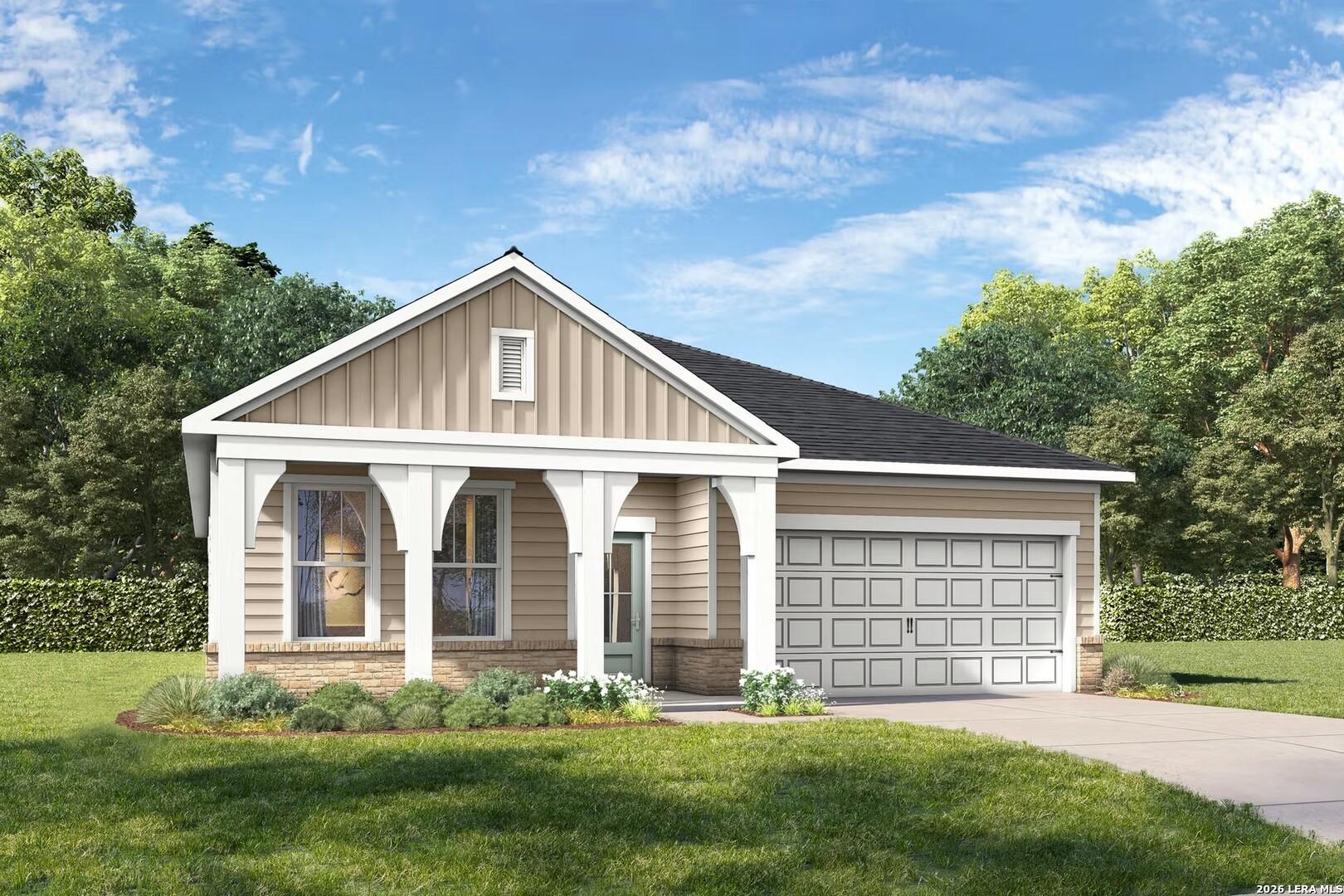 Charming beige one-story home with gabled roof, covered porch, 2-car garage and lush landscaped yard in Rayburn Valley, San Antonio, Texas
