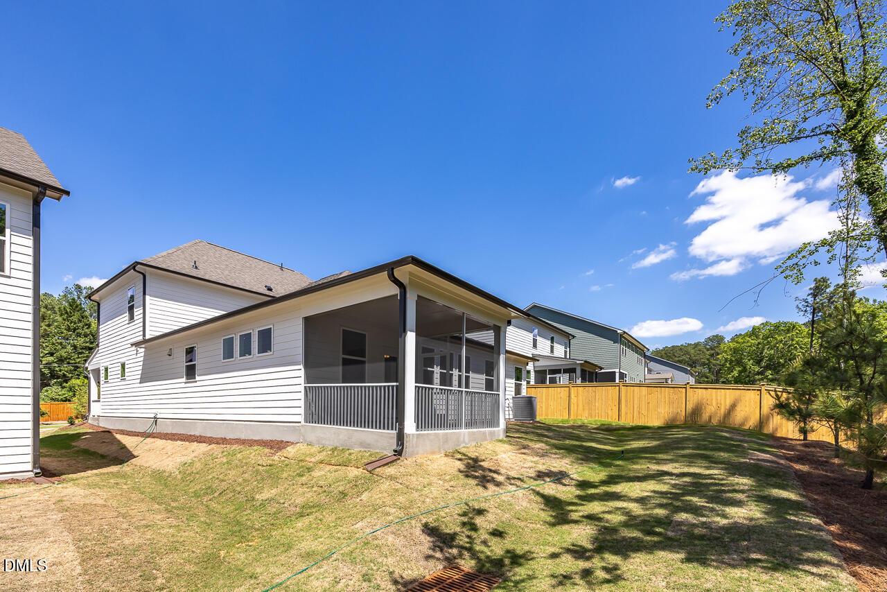 Screened-in porch and private backyard of The Ashport L floor plan at Sage on North Main in Wake Forest, North Carolina.