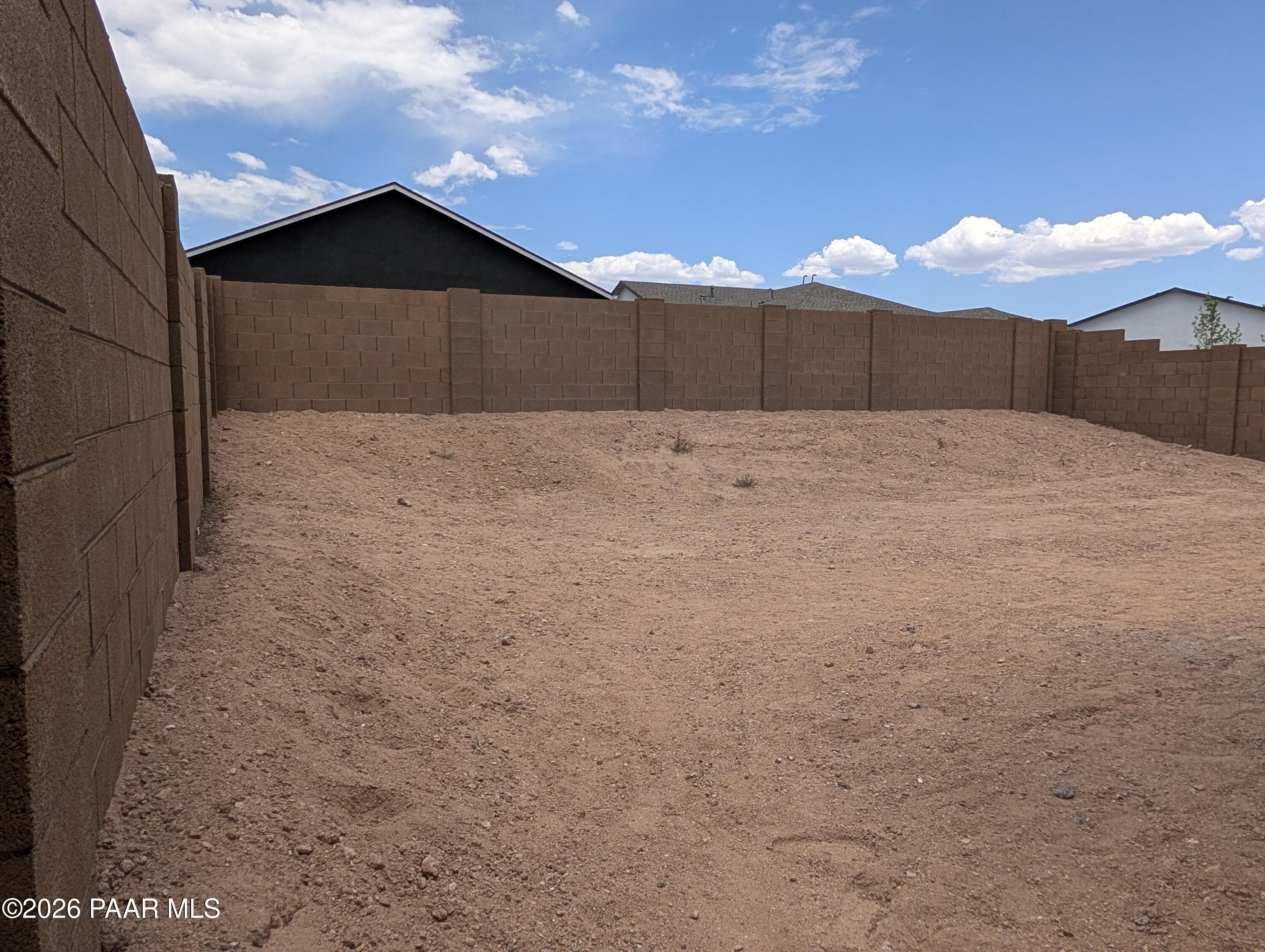 Private backyard with block wall fencing at South Ranch Destination Collection in Prescott, Arizona.