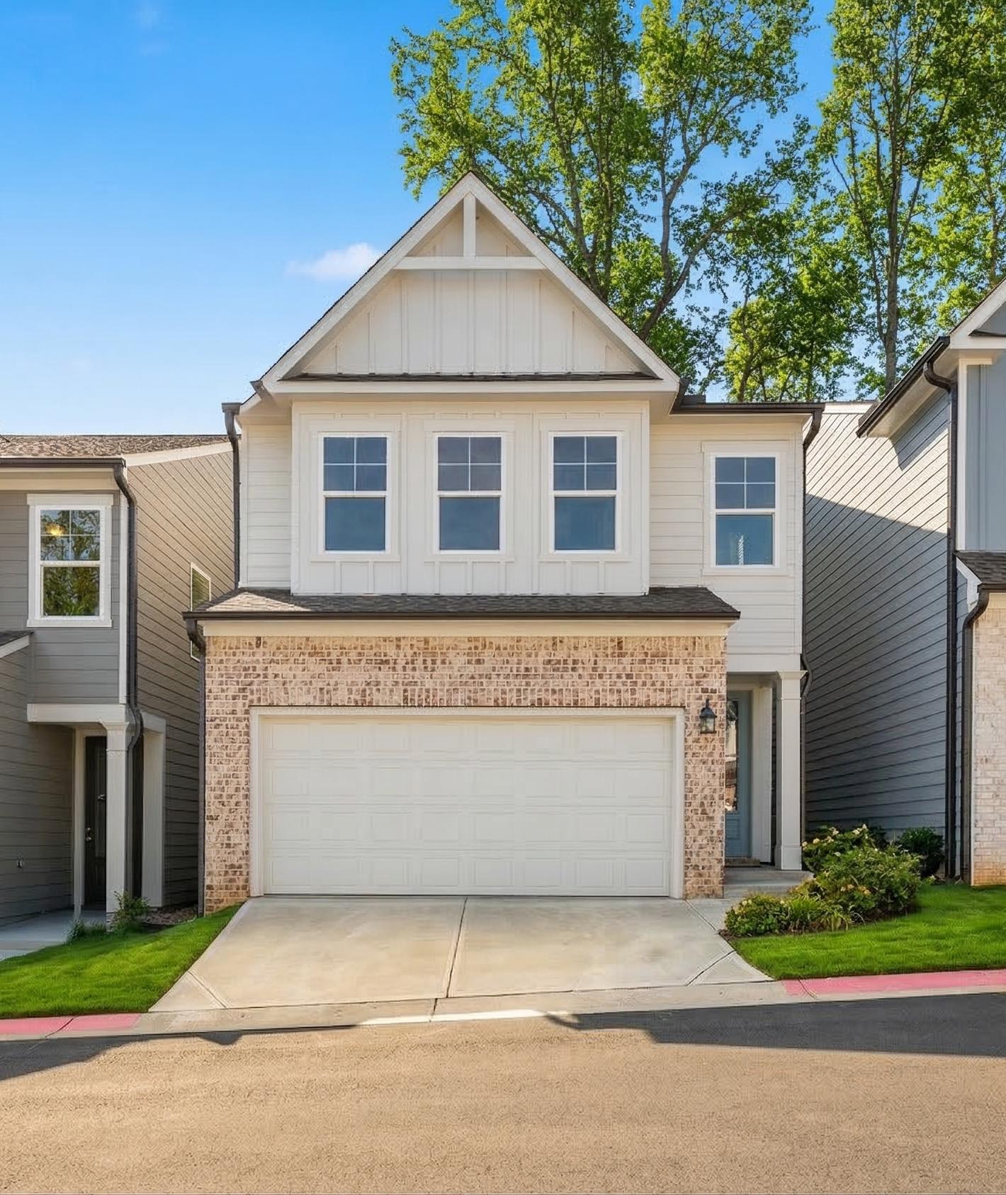 Modern farmhouse home exterior at The Village at Shallowford in Kennesaw, GA, built by Davidson Homes.
