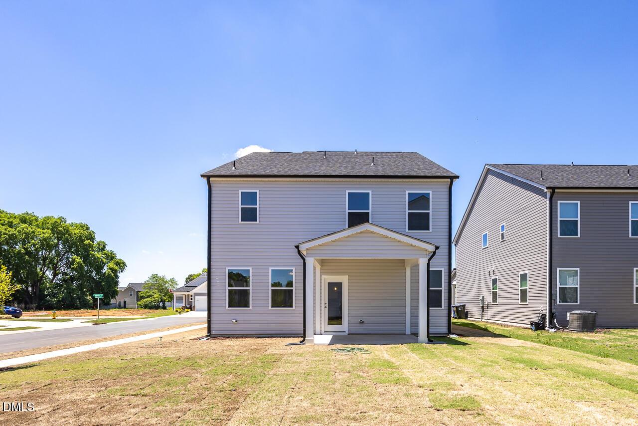 Back exterior view of The Adalynn B floor plan by Davidson Homes in Gregory Village, Lillington, North Carolina.