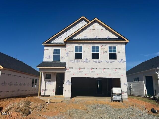 Two-story Gavin C home under construction by Davidson Homes in Gregory Village, Lillington, NC, featuring 2-car garage and windows