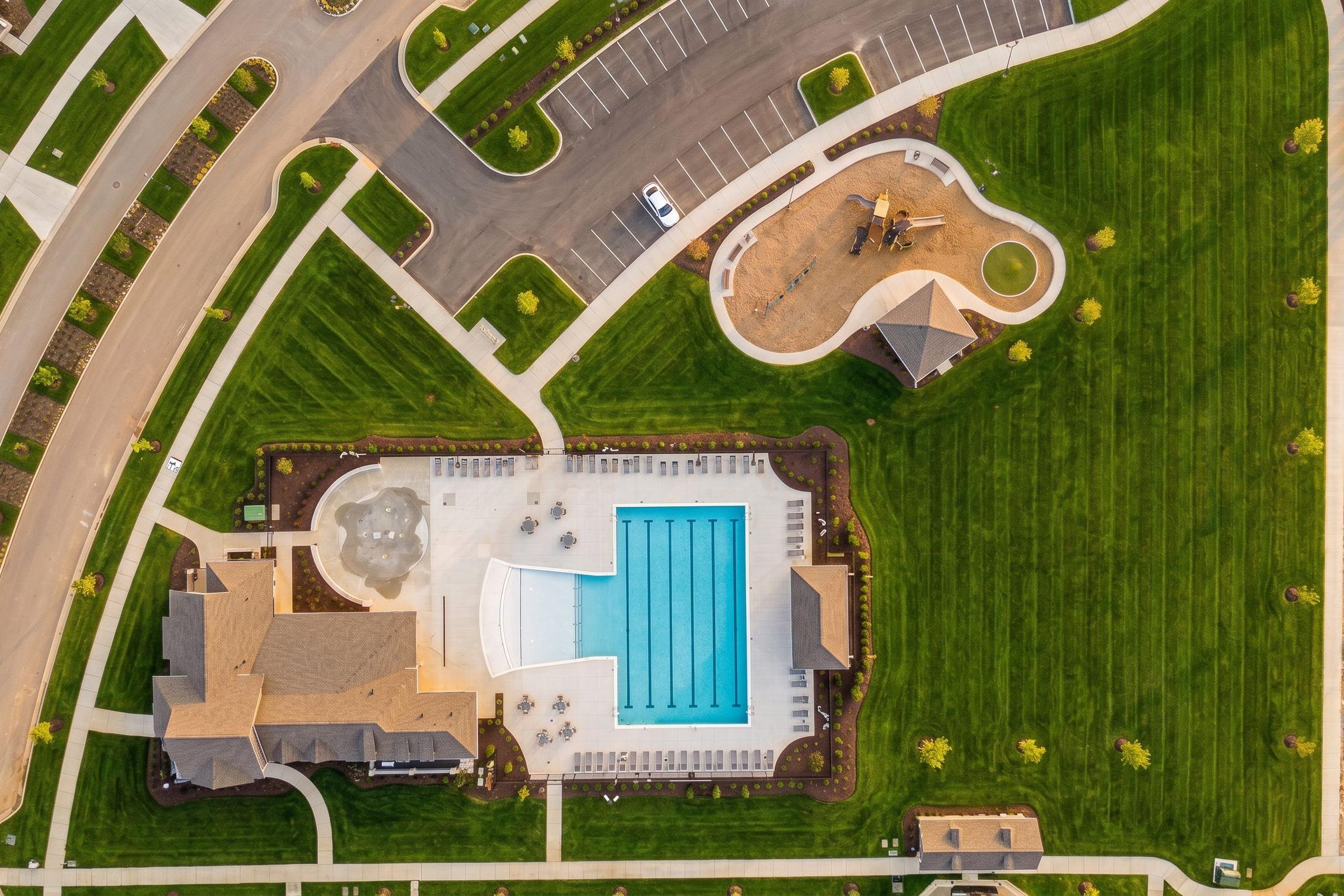 Aerial view of community swimming pool and playground at Bradshaw Farms in Mt. Juliet, TN by Davidson Homes.