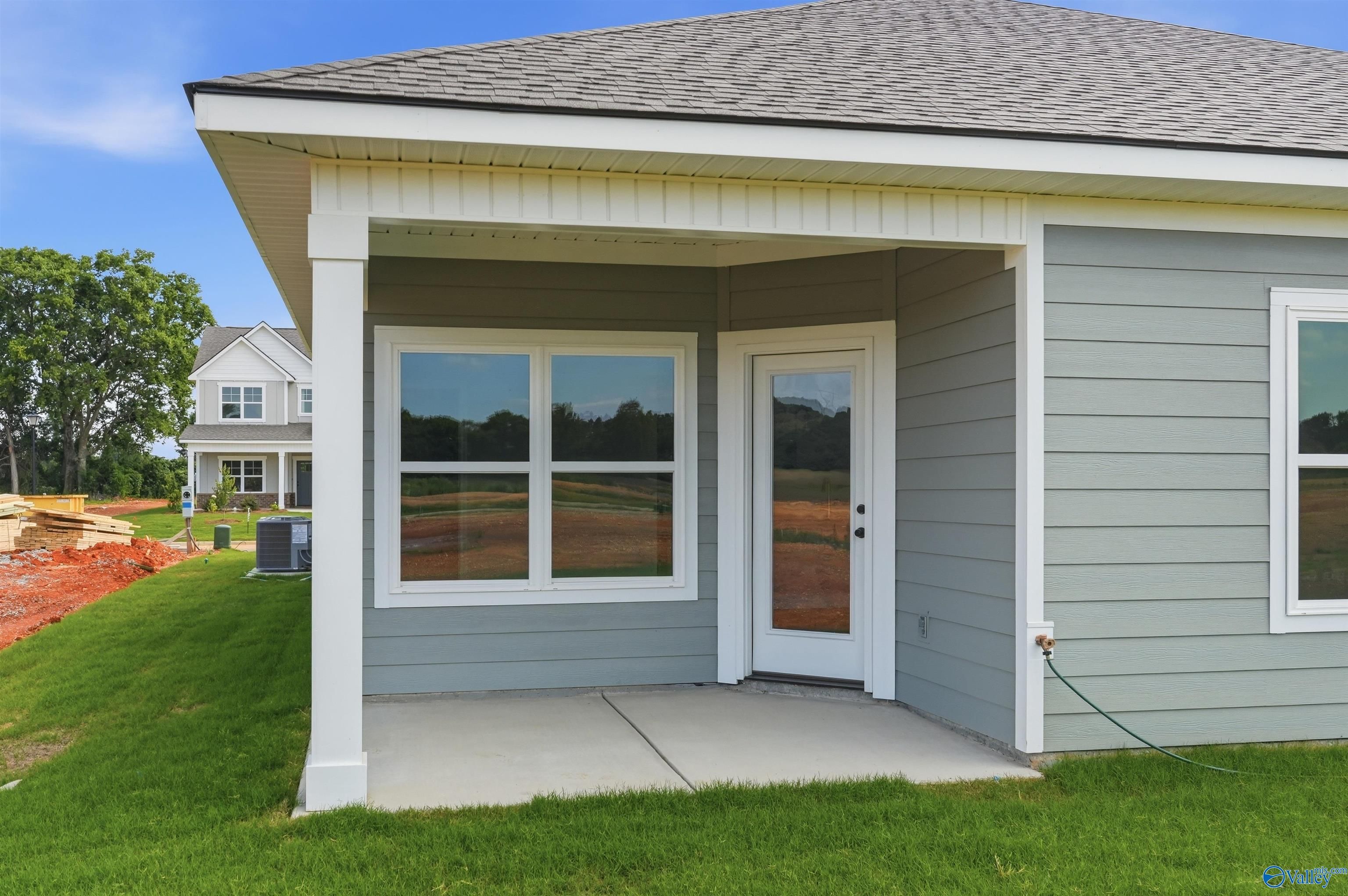 Covered back patio of The Daphne F floor plan by Davidson Homes in Berry Cove, New Market, Alabama.