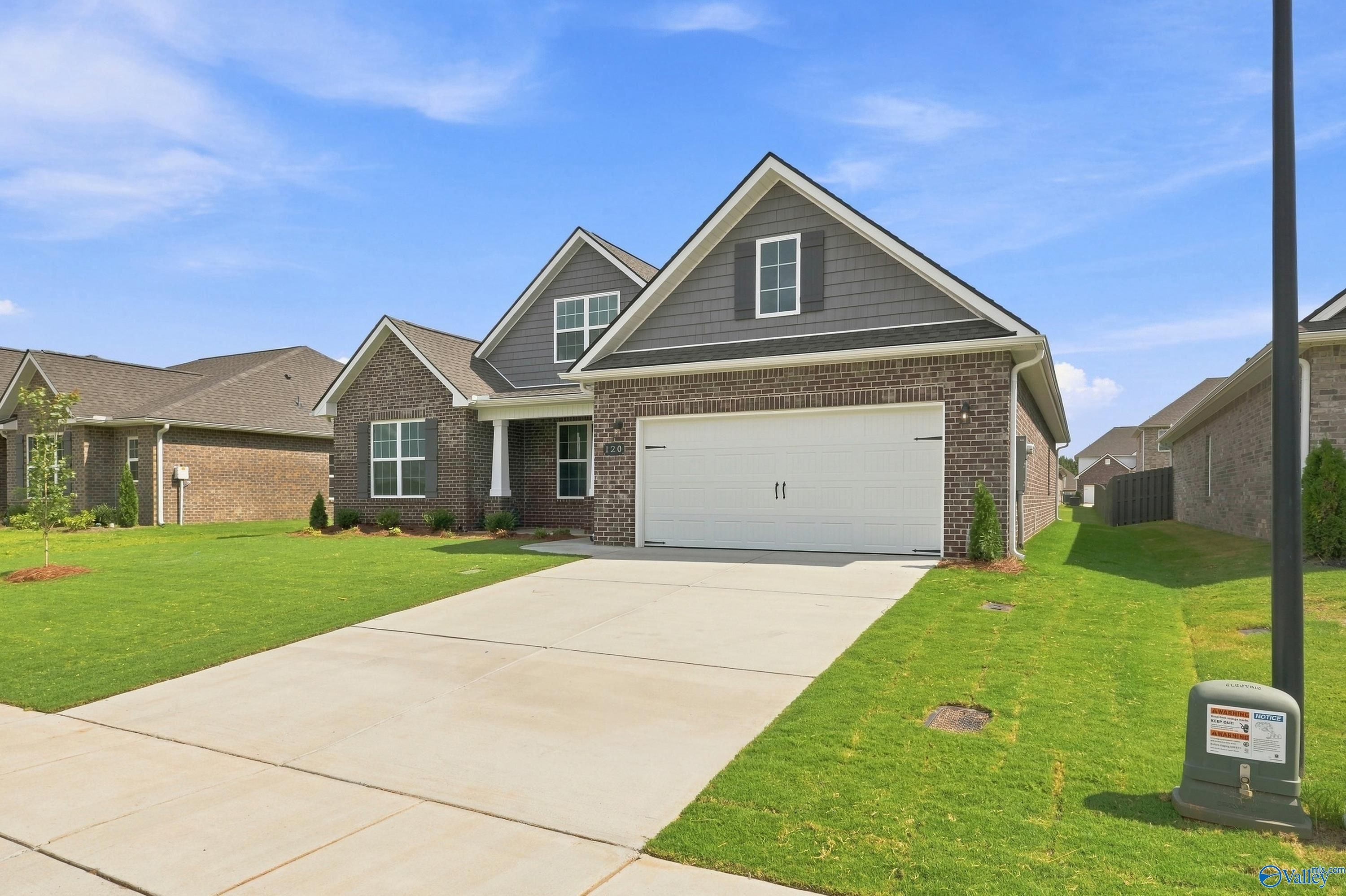 The Rockford B floor plan by Davidson Homes in Kendall Downs, Toney, Alabama featuring a brick exterior and 2-car garage.