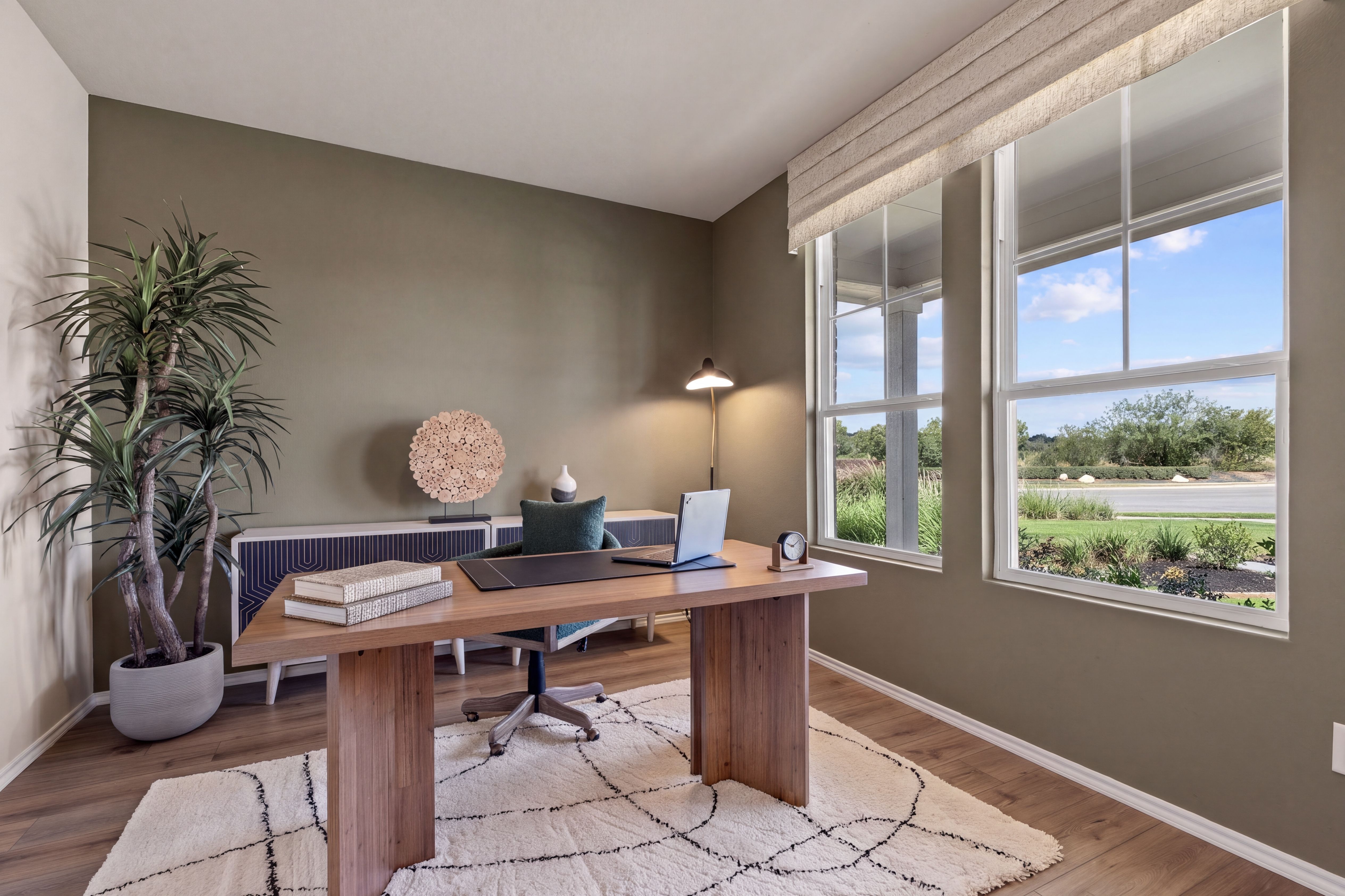 Home office with tall windows located in San Antonio, TX