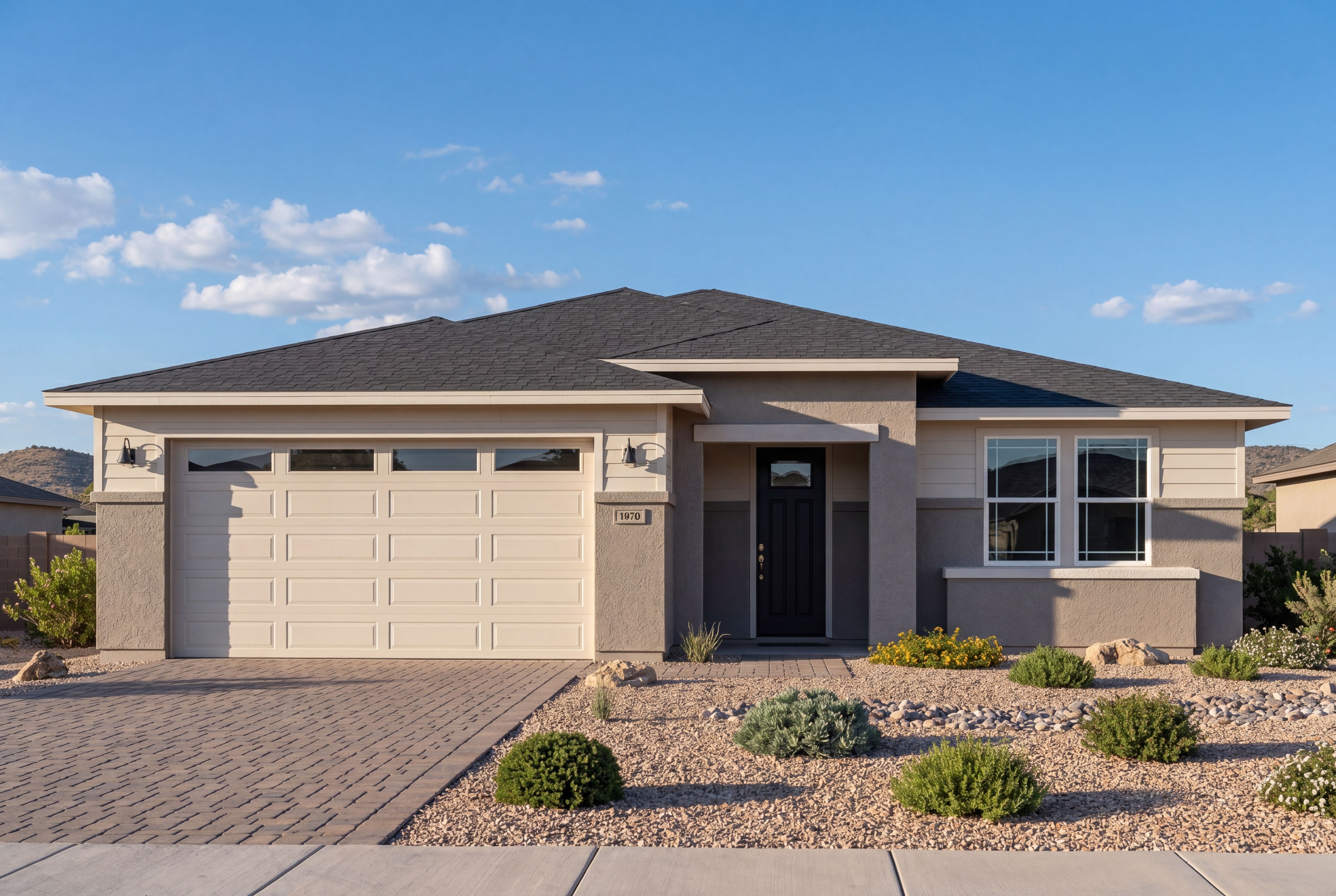 Modern exterior elevation of The Sheridan II by Davidson Homes featuring a 3-car garage and desert landscaping in Prescott.