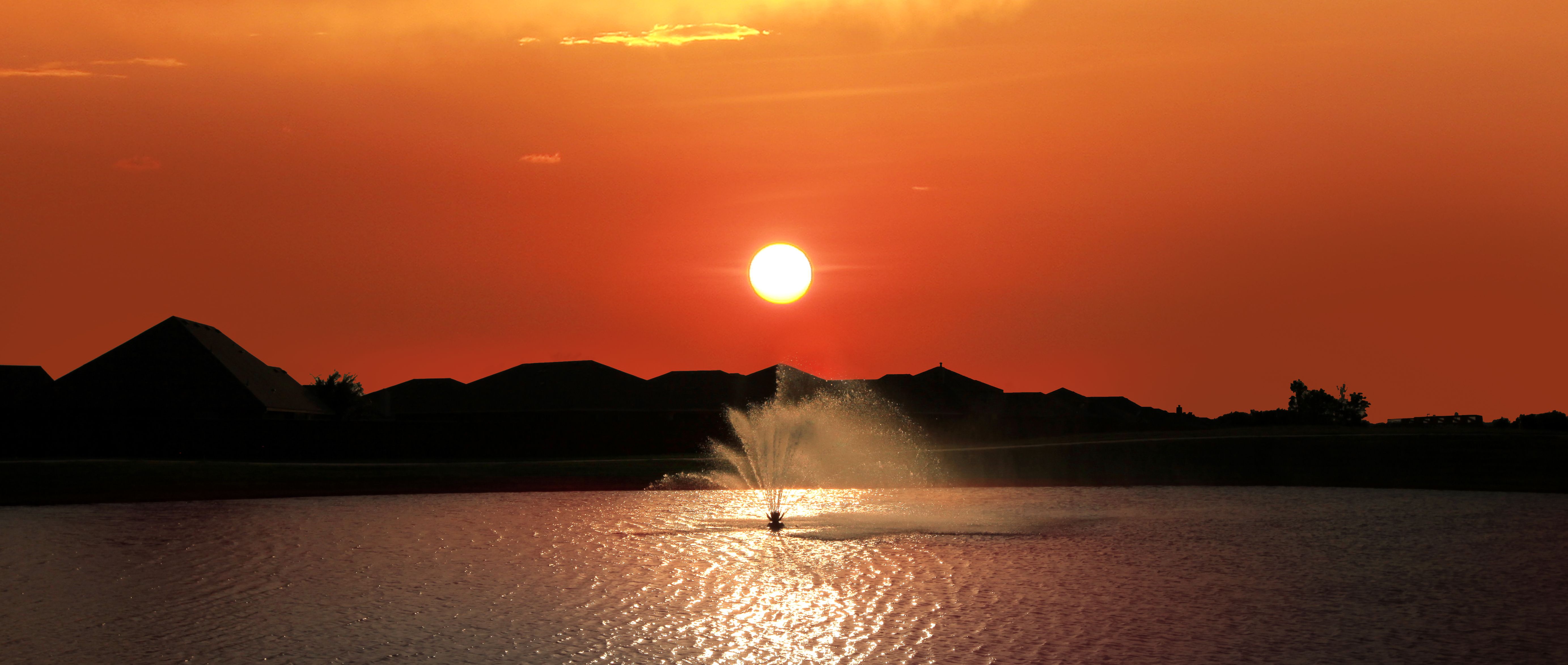 Twilight image of the amenity lake with fountain