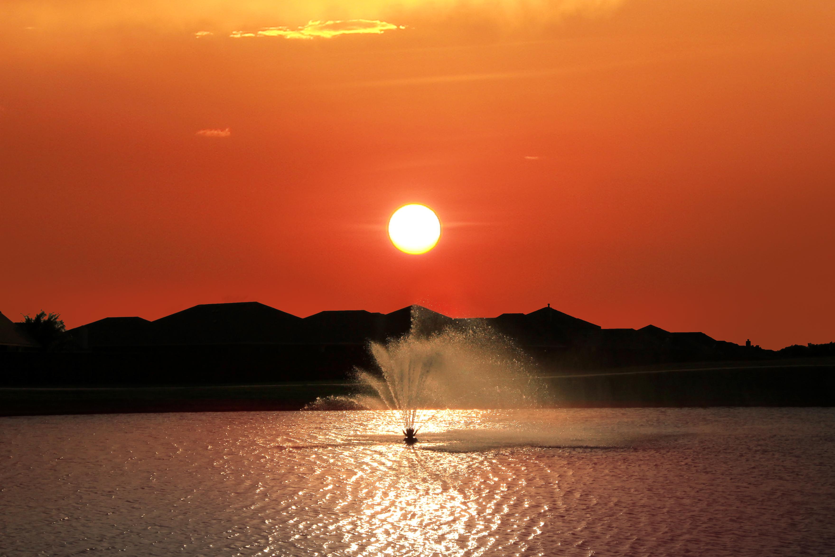 Twilight image of the amenity lake with fountain