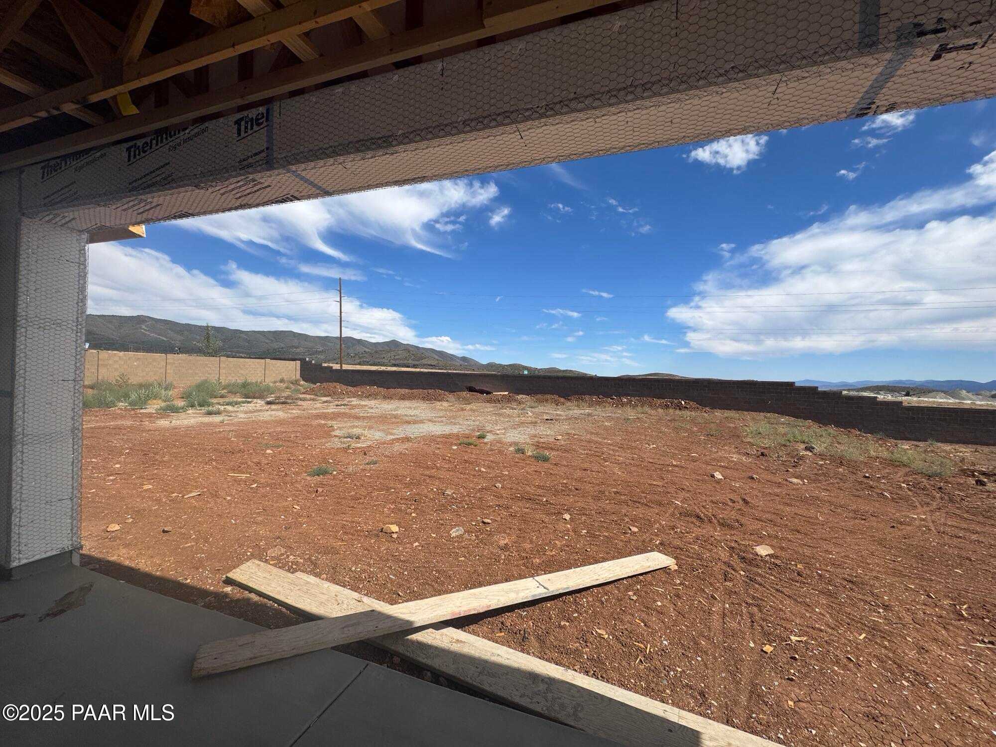 Scenic Bradshaw Mountains and desert landscape view from garage framing in Evermore Homes The Sunrise A, Prescott Valley, AZ