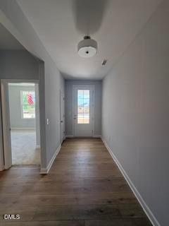 Bright entryway with hardwood floors and front door in The Daphne D floor plan at Woodland Crossing, Zebulon, North Carolina.