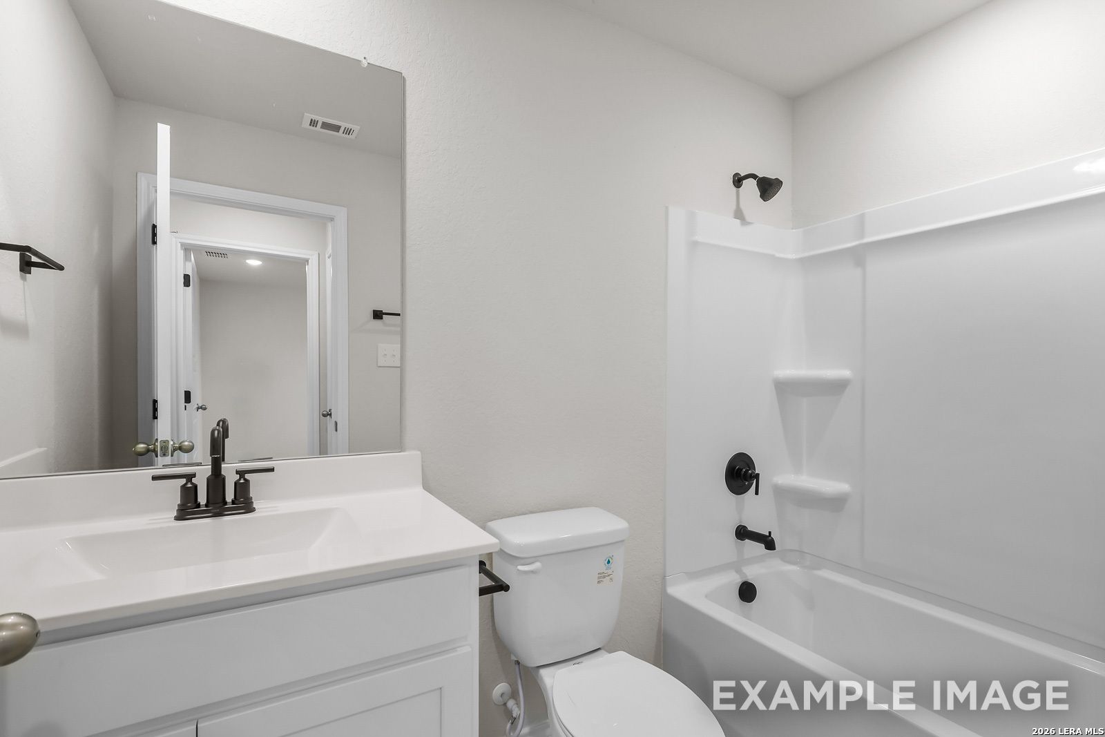 Modern bathroom with white vanity and tub-shower combo in The Sequoia C floor plan by Davidson Homes in San Antonio, Texas.