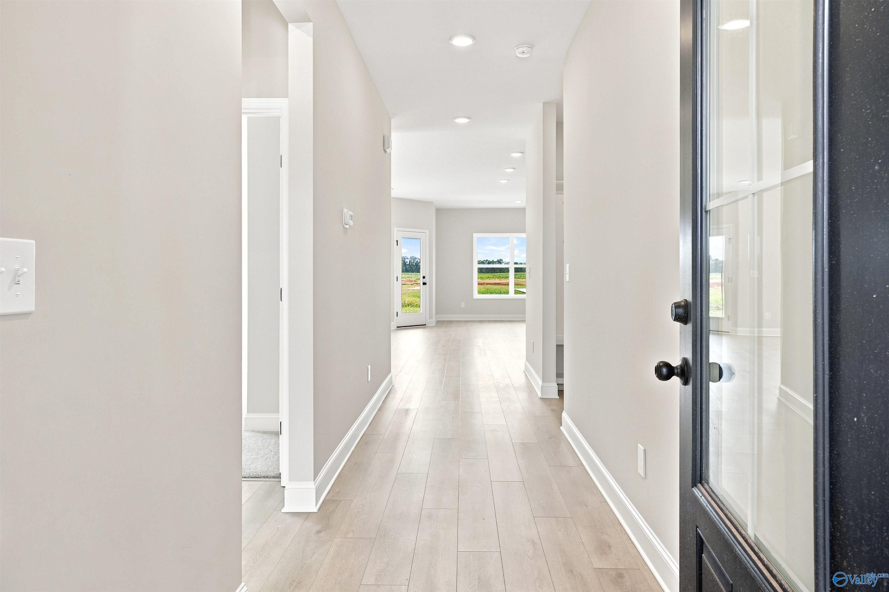 Bright, open foyer and hallway leading to the living area in a Davidson Homes Franklin B plan in Clearview, Hazel Green.