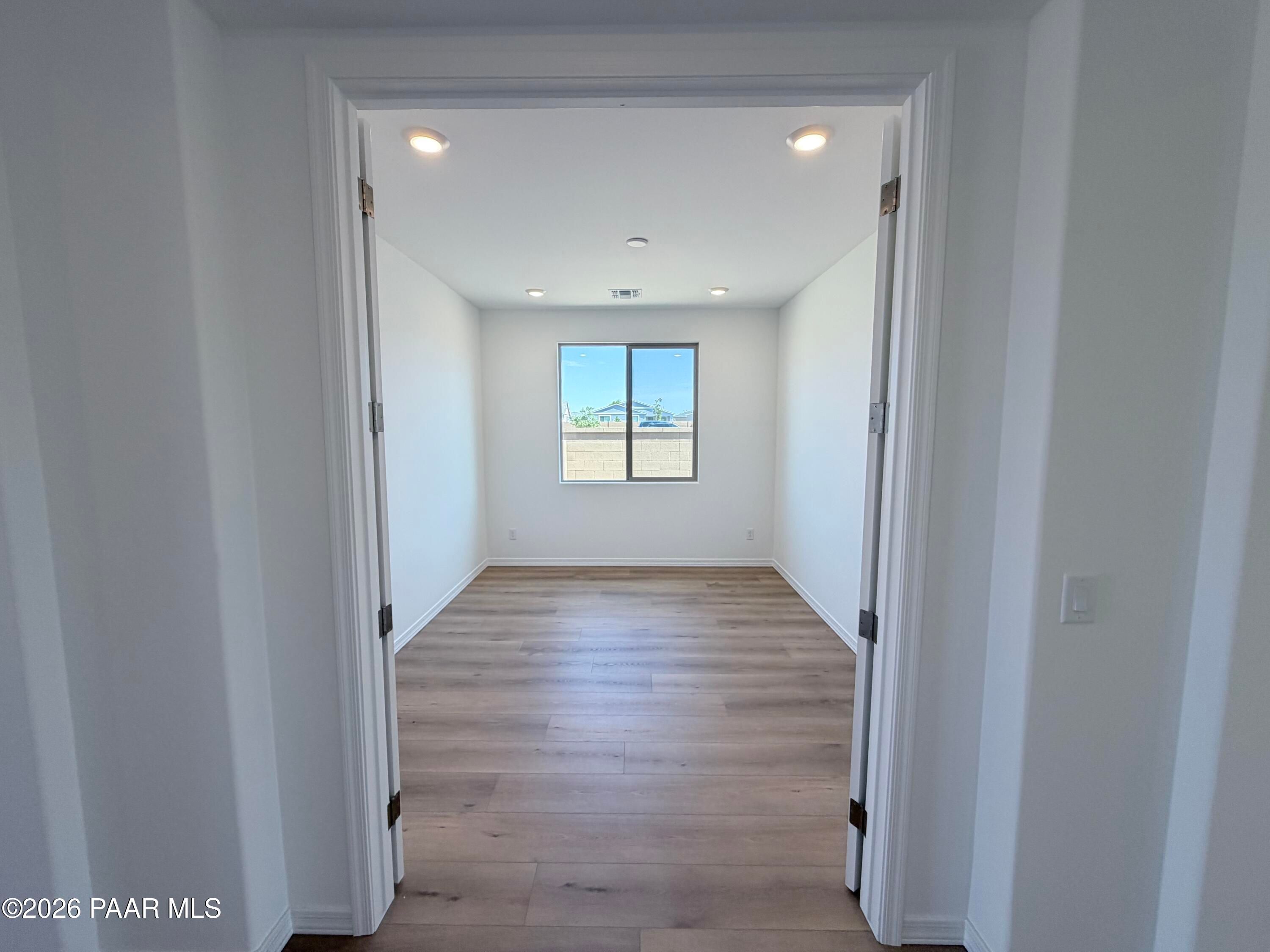 Bright, flexible den or office space with wood-look flooring in The Inspiration C home, North Ridge at Pronghorn Ranch.