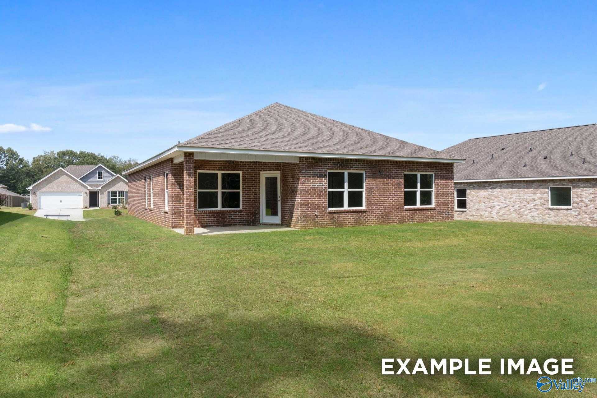 Single-story brick ranch home with 2-car garage and lush green lawn in Lynn Meadows, Meridianville, Alabama - Davidson Homes The Franklin