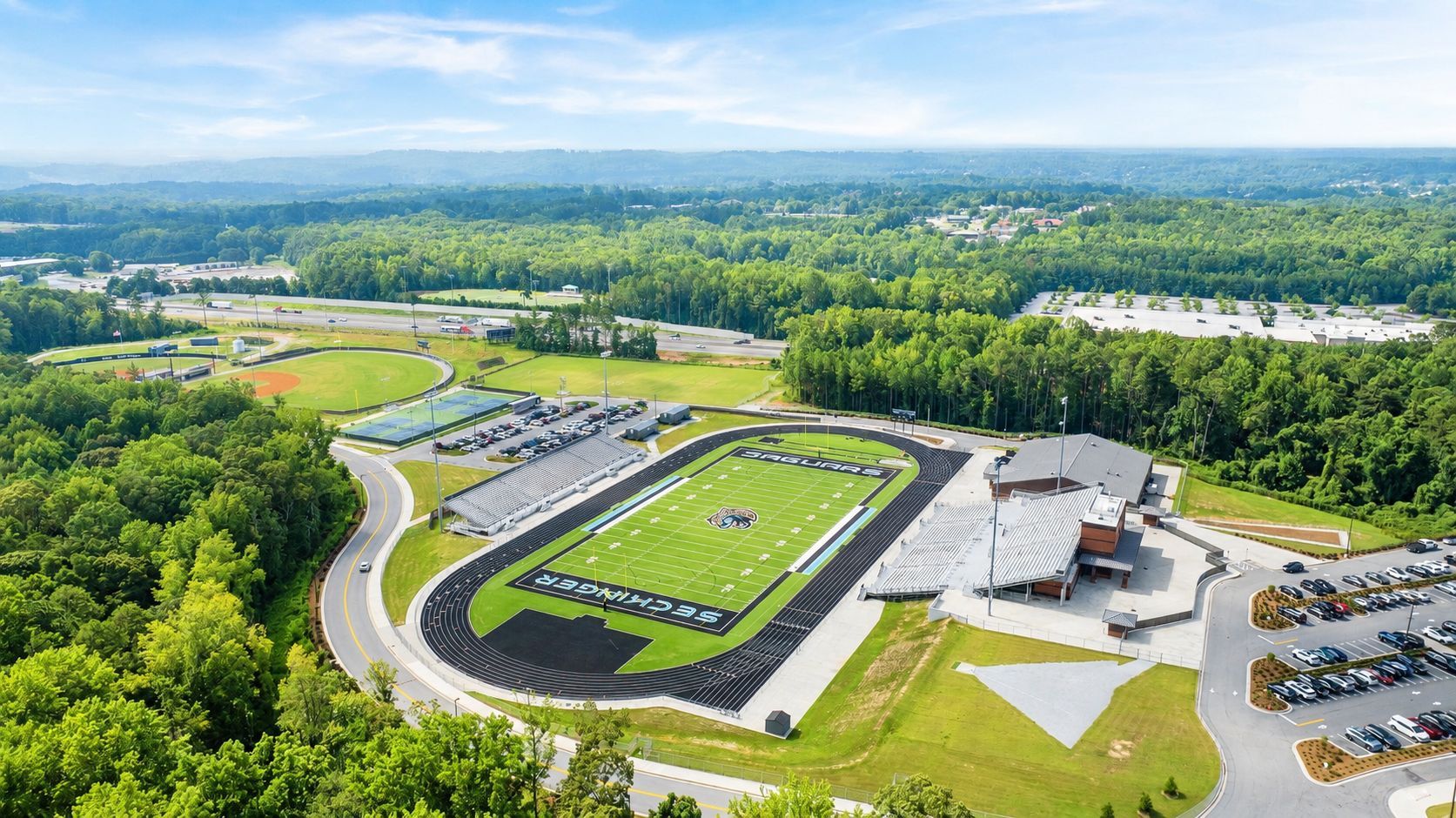 Aerial view of Seckinger High School stadium near Fern Hollow in Buford, Georgia, built by Davidson Homes.